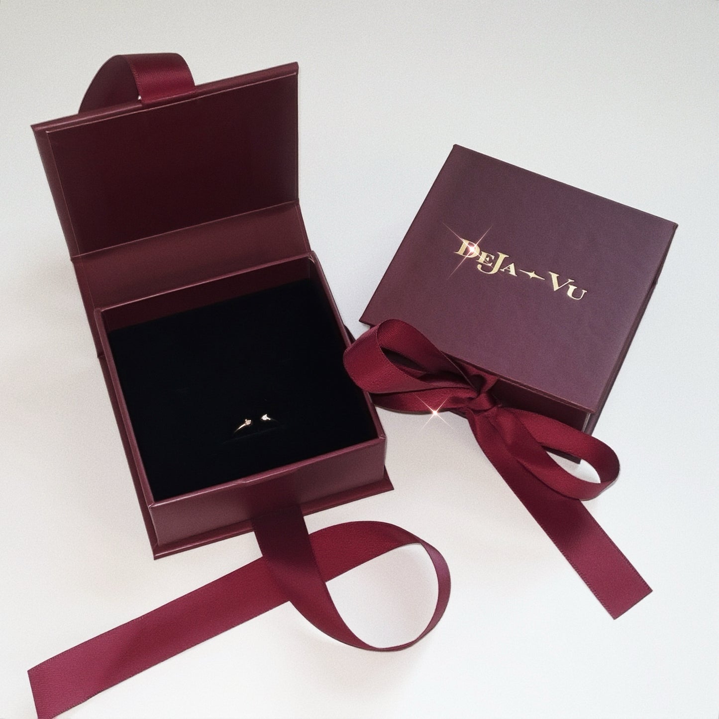 Deja vu Jewellery burgundy gift box with dainty gold open pinky ring inside