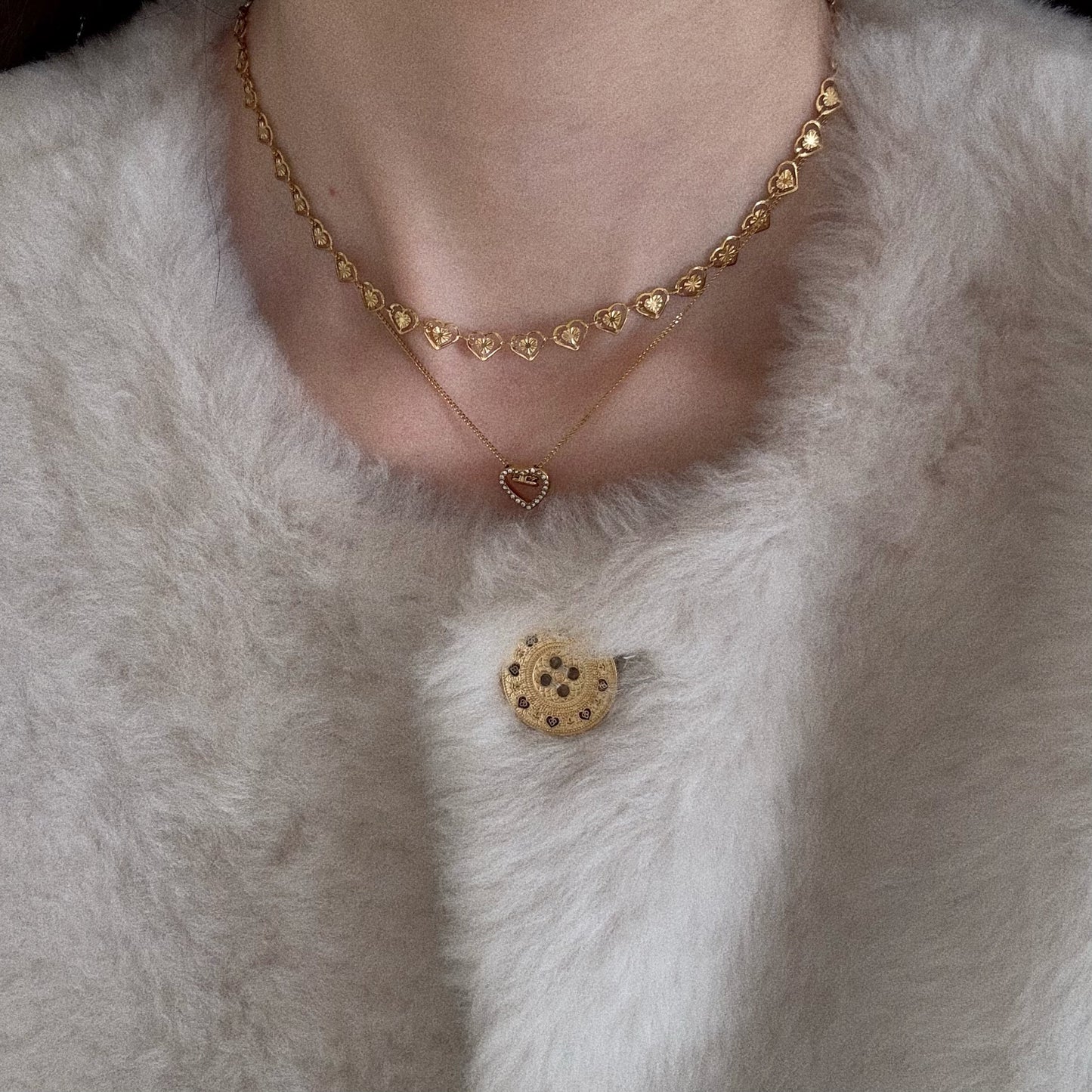 Close up view on neck showing how the 40cm gold heart choker sits perfectly at the collarbone.