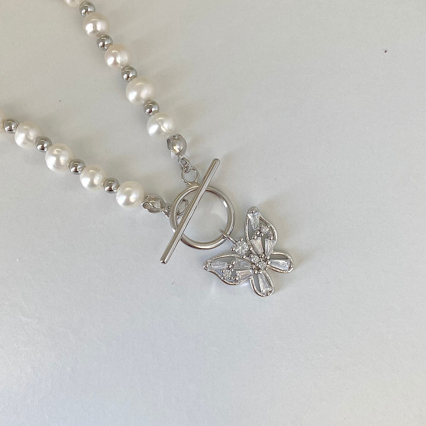 Elegant Pearl Cascade S925 Silver Butterfly Necklace