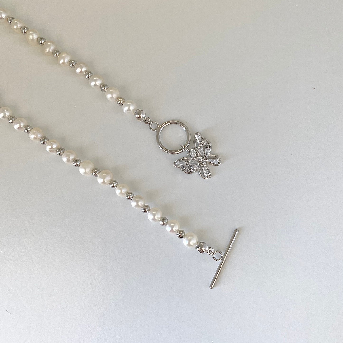 Elegant Pearl Cascade S925 Silver Butterfly Necklace