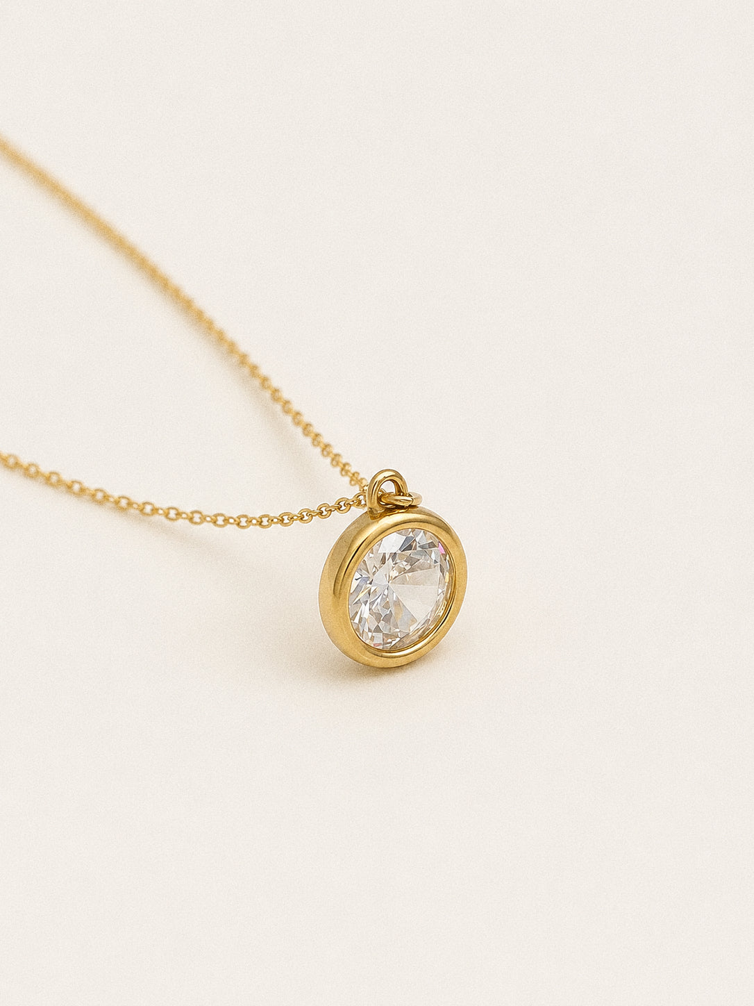 Aura 2 carat waterproof solitaire necklace with round cubic zirconia in an 18k gold bezel on a fine chain