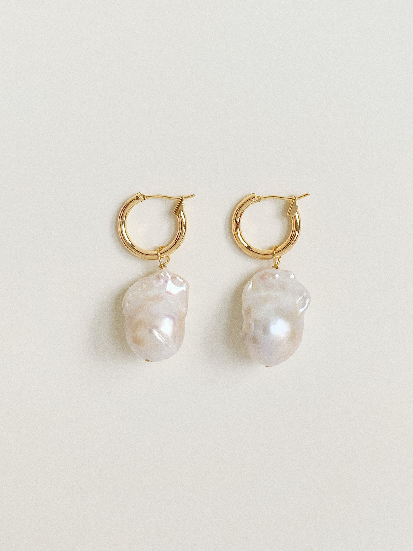 Pair of 14k gold plated hoop earrings with large 11-13mm natural baroque pearl drops.