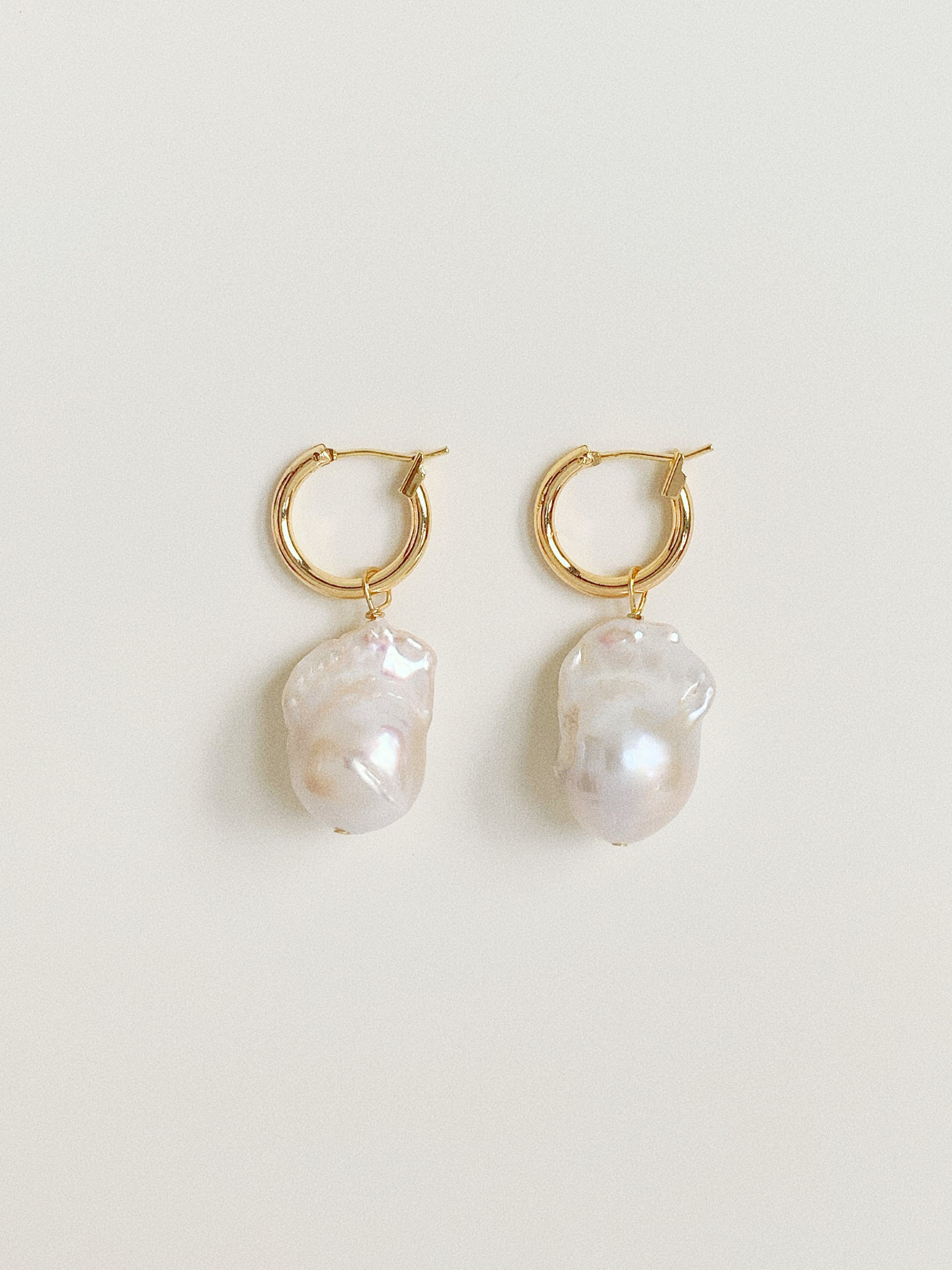 Pair of 14k gold plated hoop earrings with large 11-13mm natural baroque pearl drops.