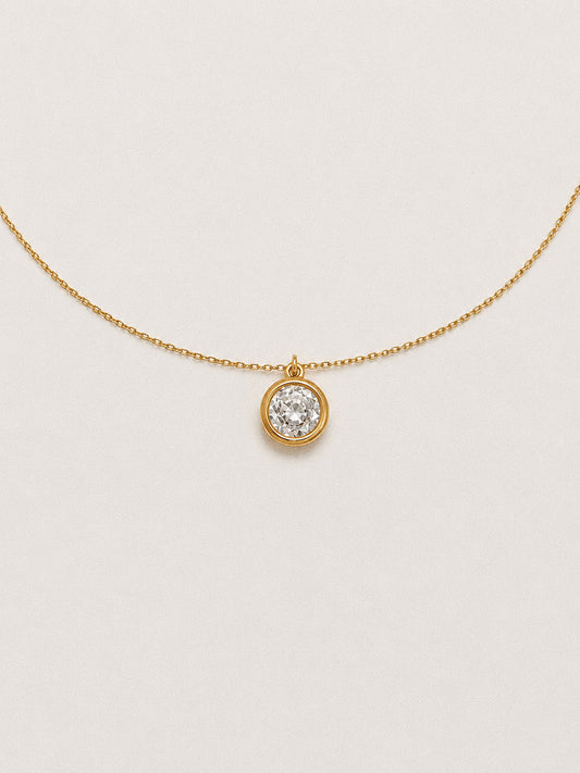 Front view of the 2 carat solitaire necklace with the bezel pendant centred on a fine gold chain