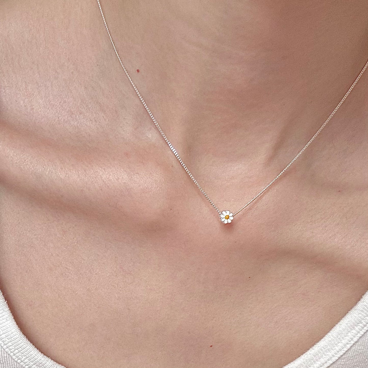 Petite sterling-silver daisy necklace on model, 6 mm enamel charm