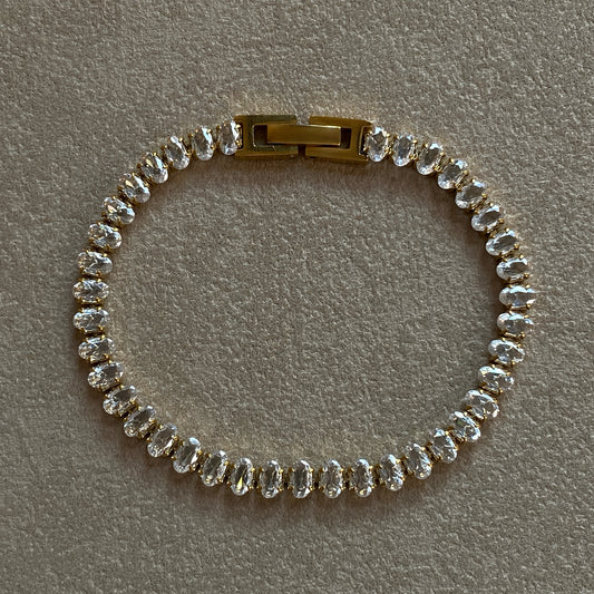 Full front view of gold Oval CZ Tennis Bracelet, 17.5 cm length with box clasp—0.5 cm wide oval CZ stones.