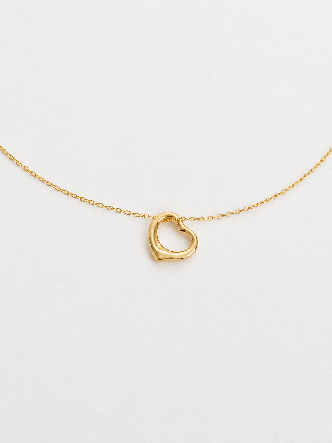 Dainty gold floating open heart pendant necklace in 18k gold plated 925 sterling silver on a fine cable chain