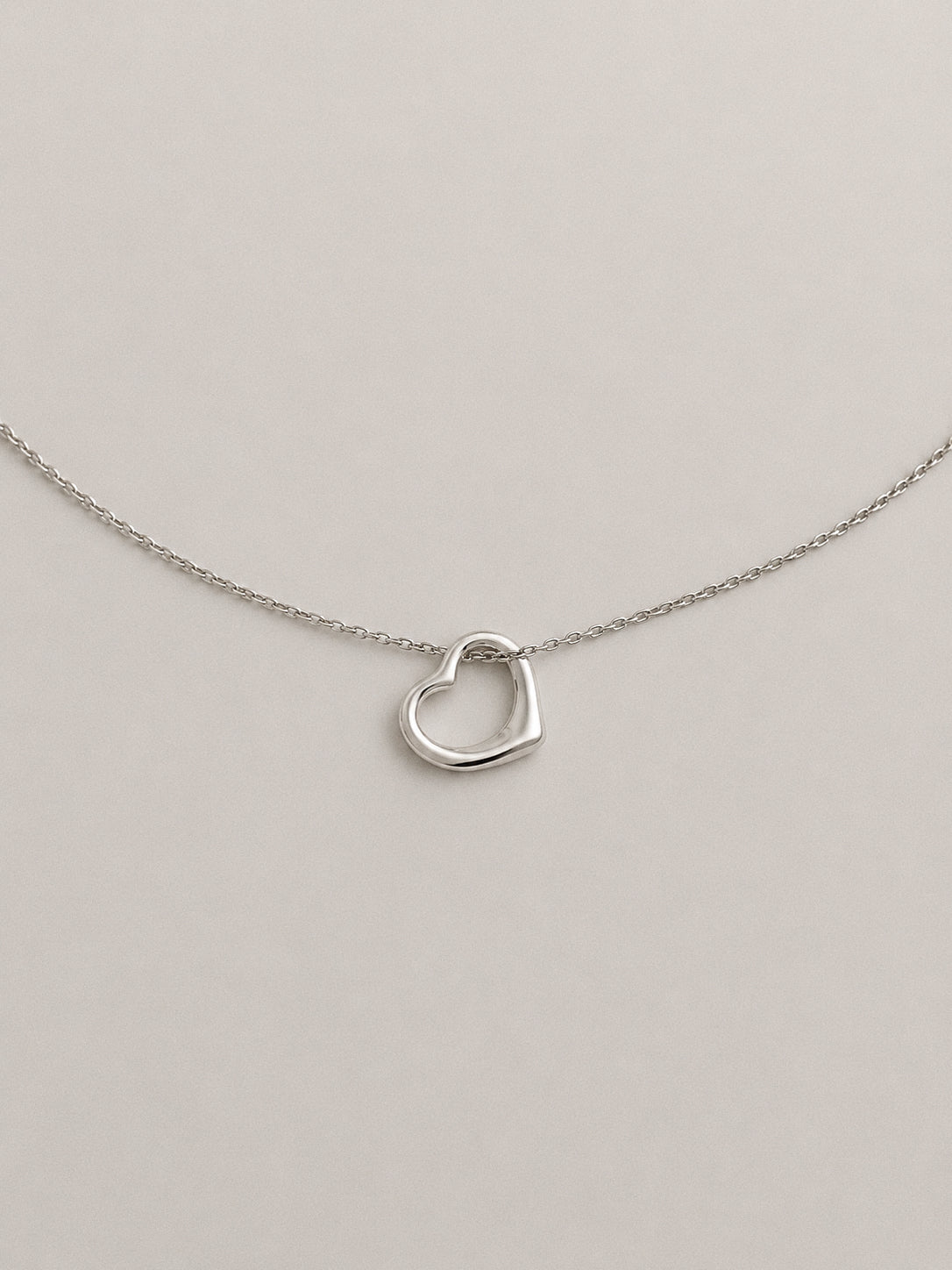 Dainty silver floating open heart pendant necklace in 925 sterling silver on a fine cable chain
