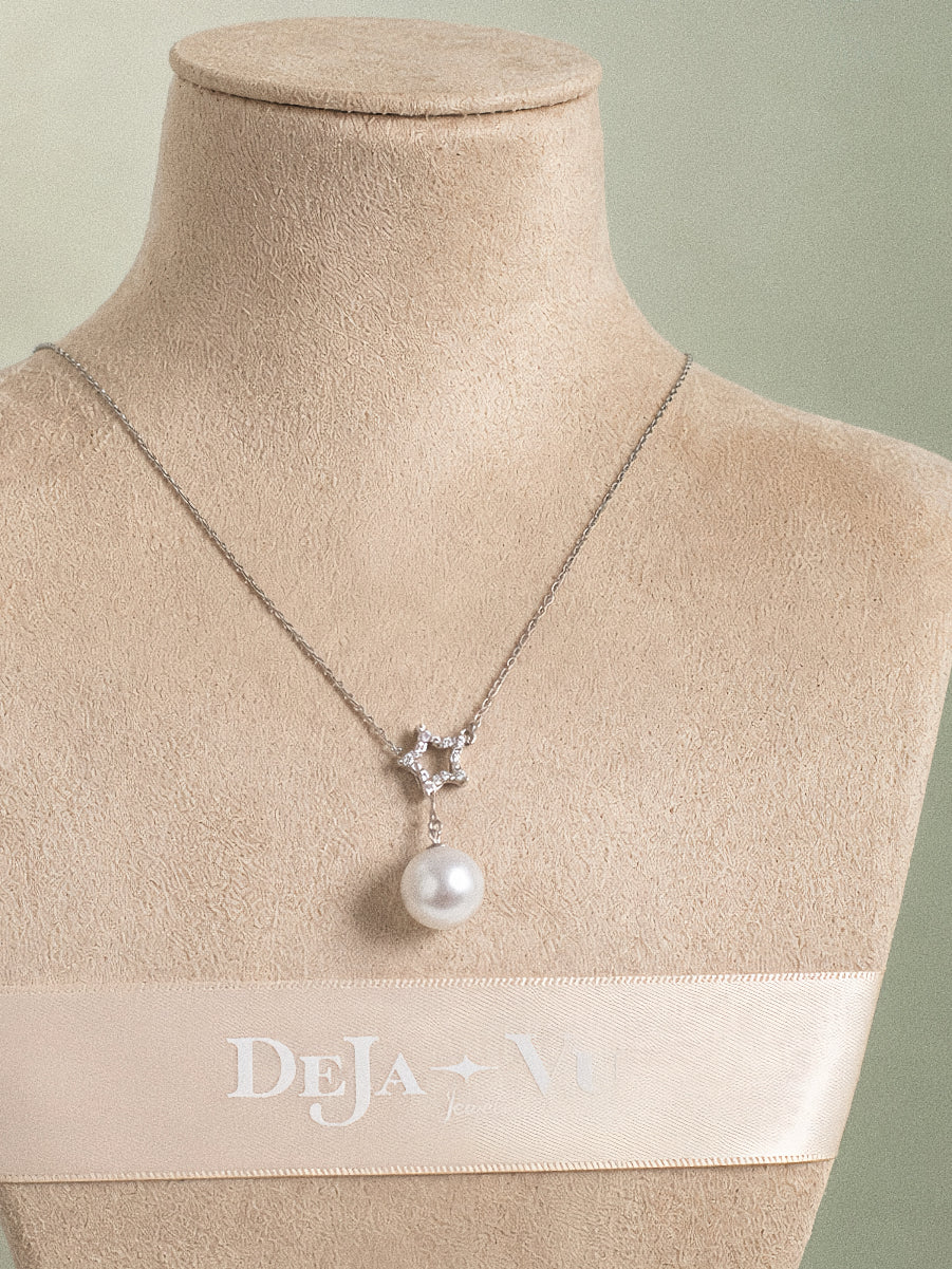 Astra sterling silver pearl Y necklace with an open five-point star and round 11 mm Edison pearl.