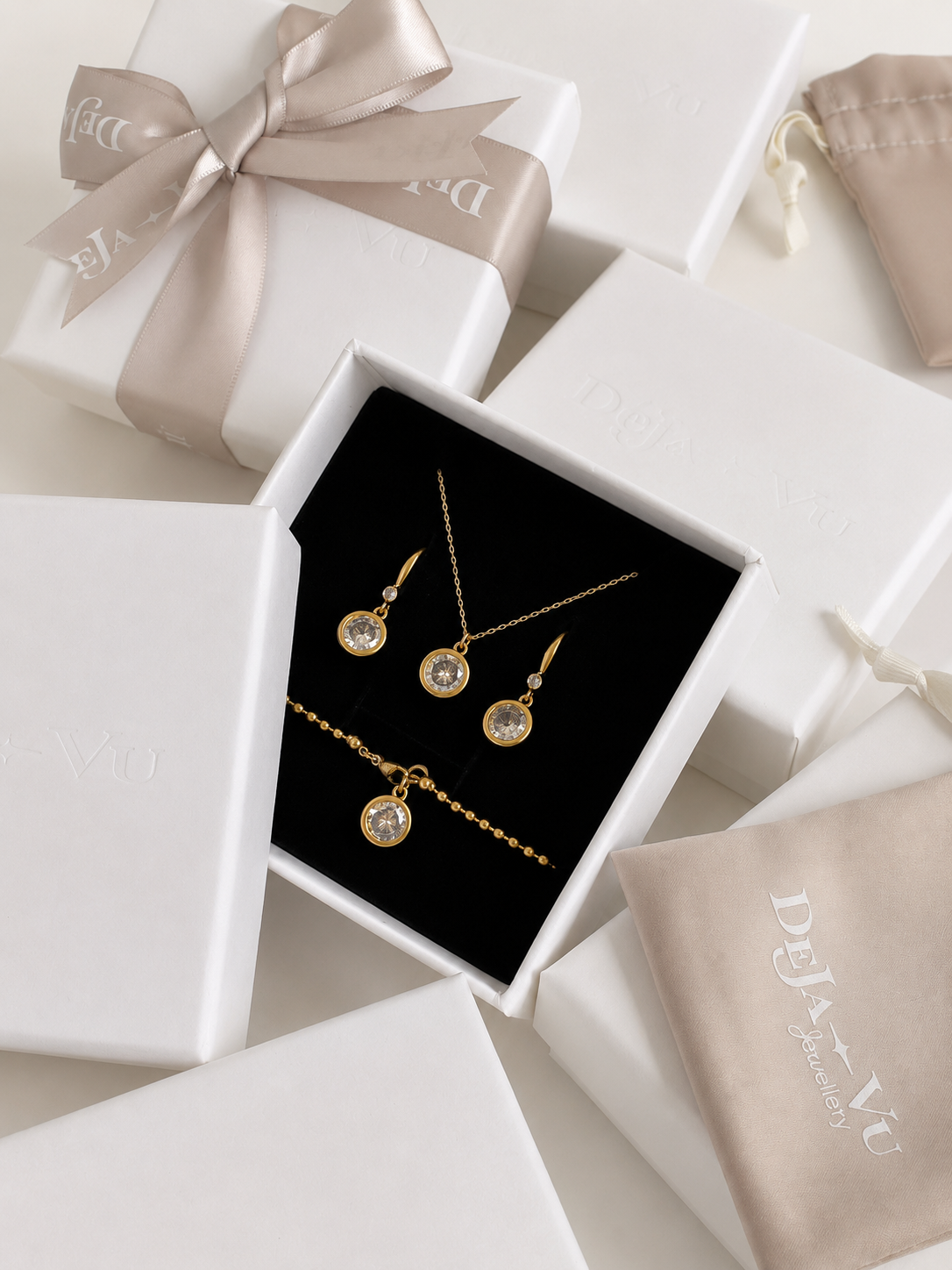 Aura bracelet in a Deja Vu Jewellery gift box with the matching solitaire necklace and drop earrings