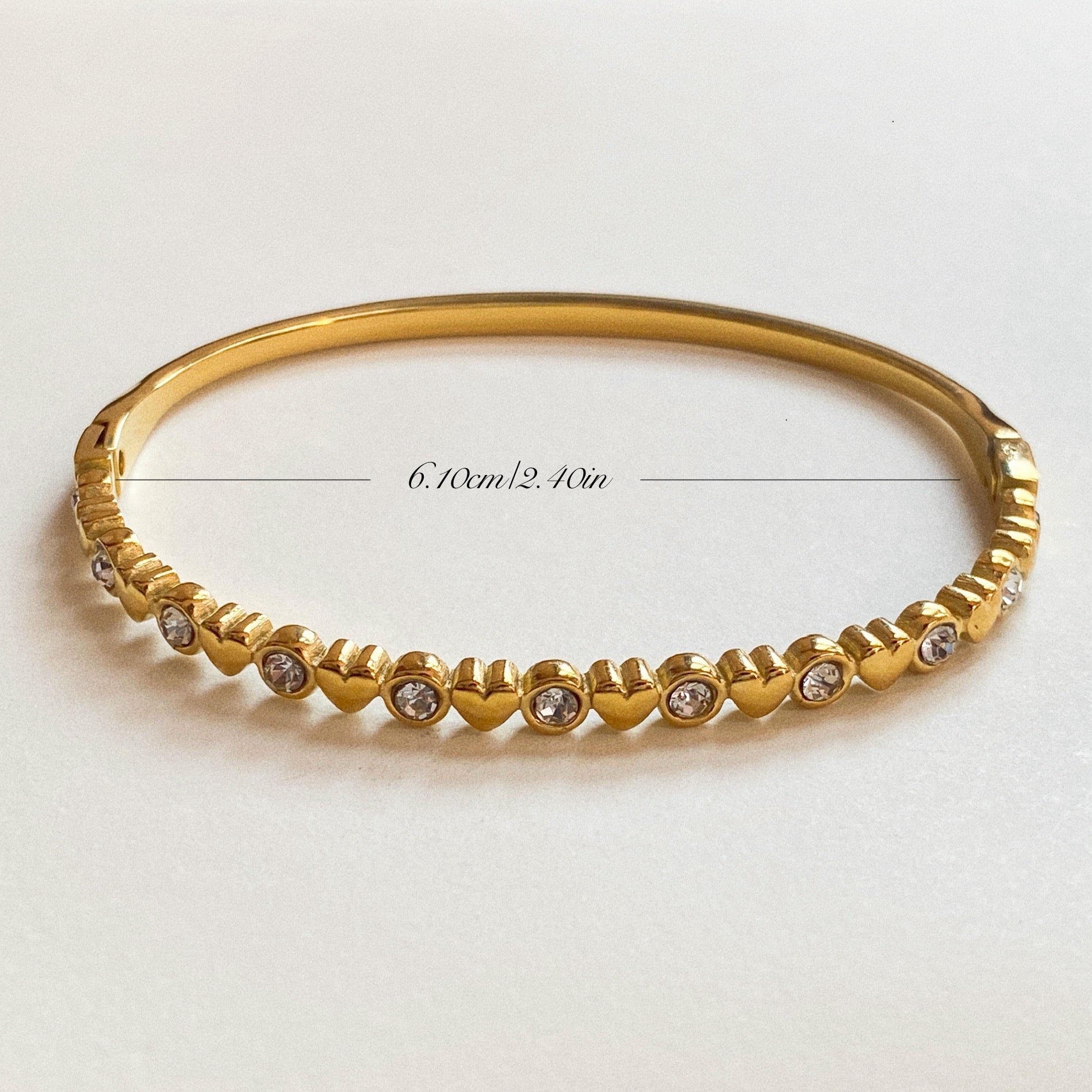 Gold stainless steel heart CZ bangle with inner diameter measurement 6.10 cm (2.40 in) – waterproof hypoallergenic bracelet size guide