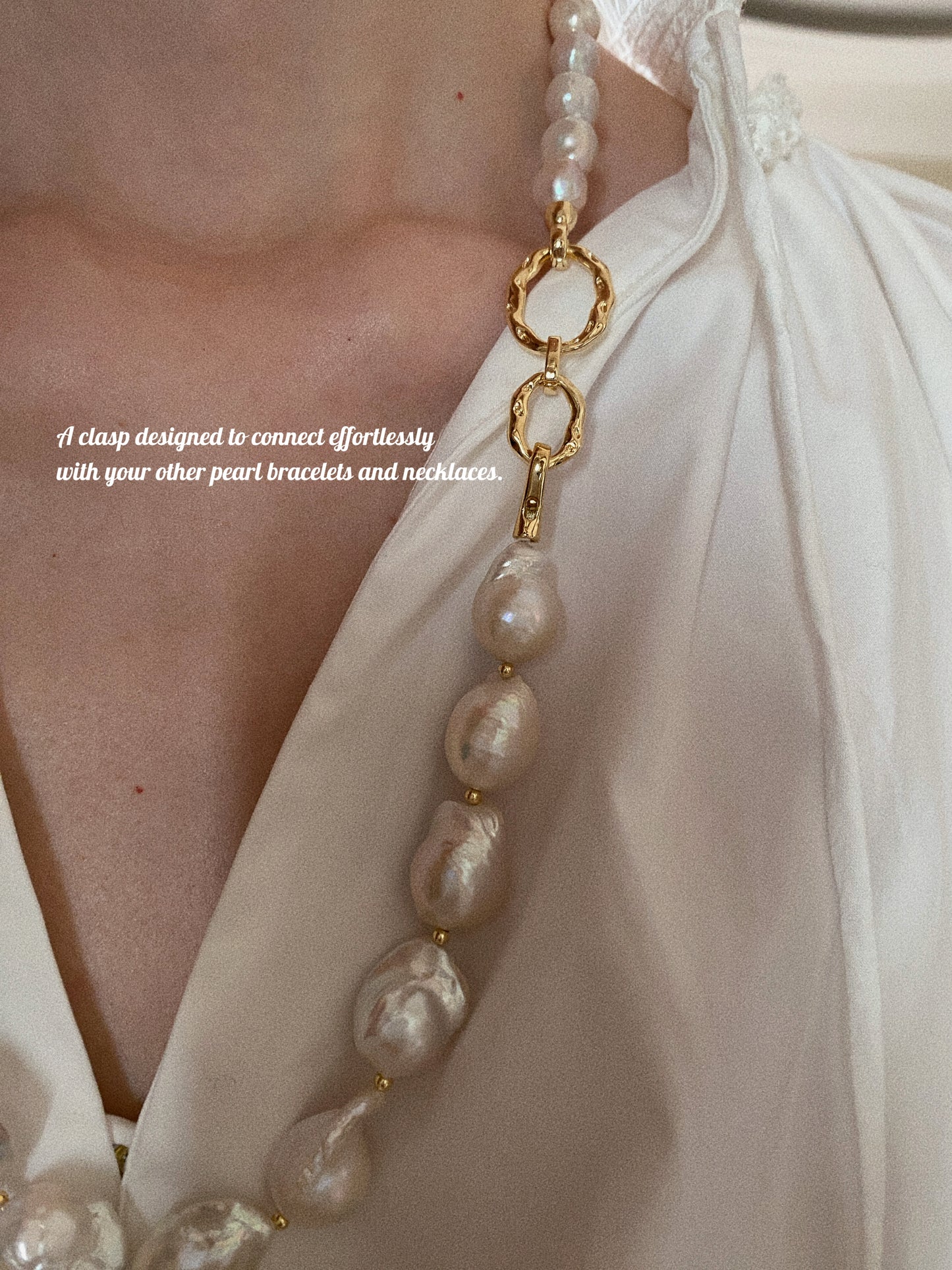Grand Baroque pearl necklace styled on model in white blouse showing front-facing gold clasp detail