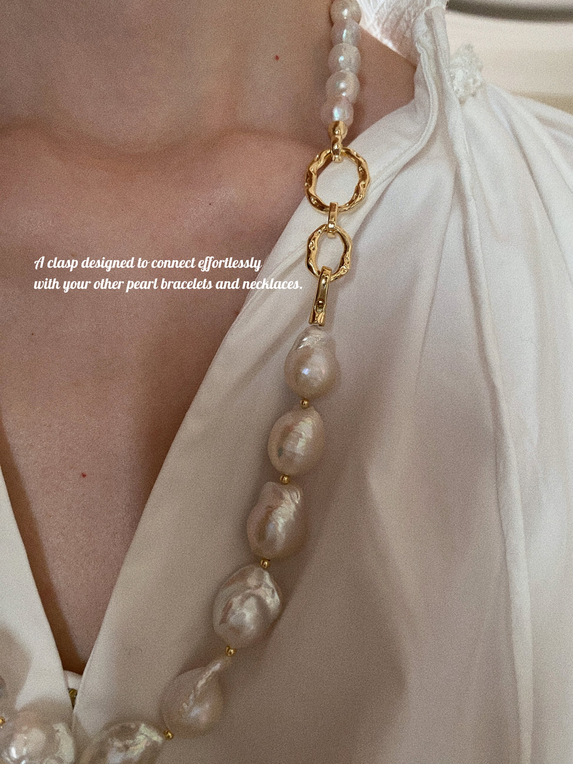 Grand Baroque pearl necklace styled on model in white blouse showing front-facing gold clasp detail