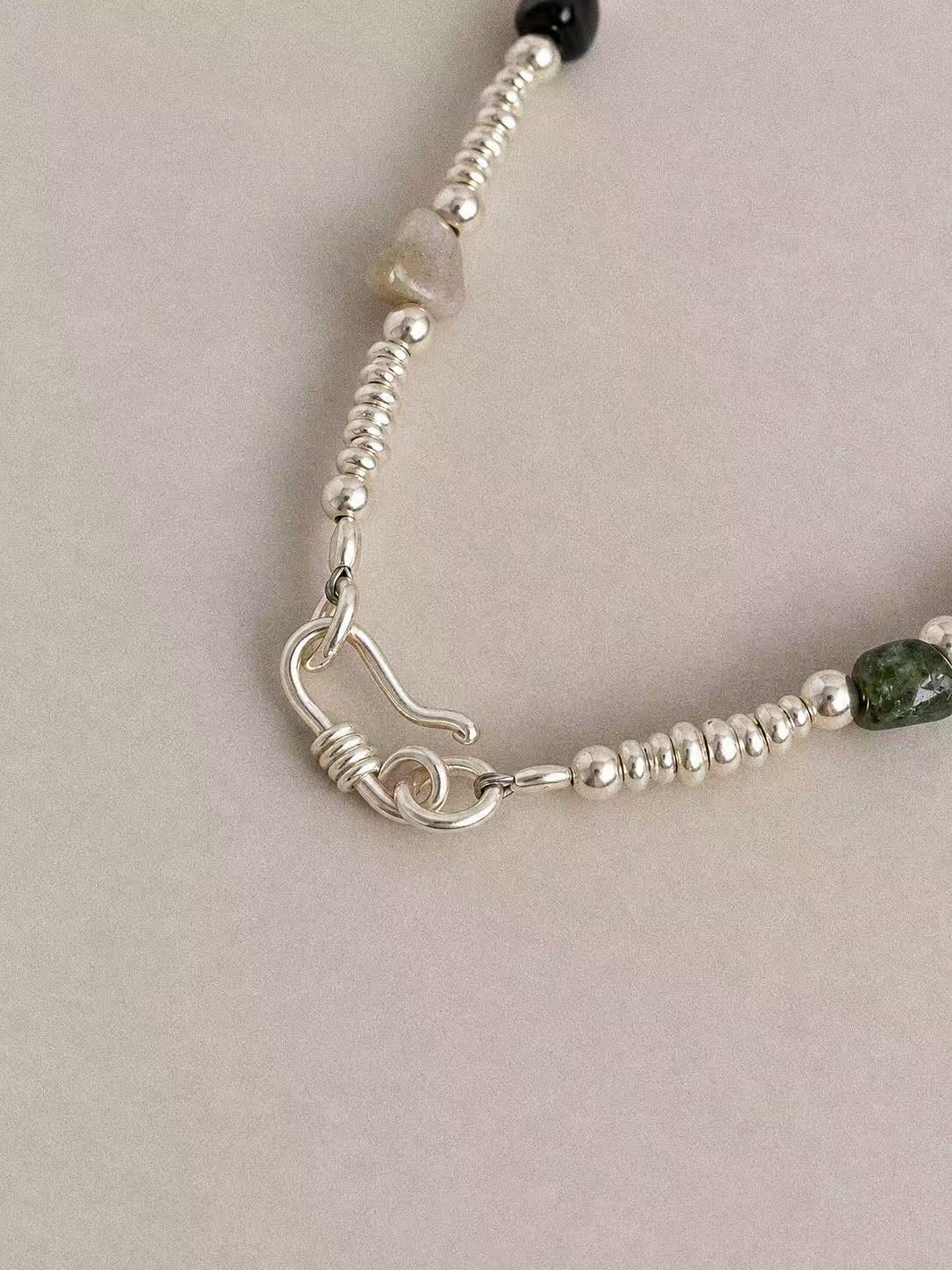 Hook-and-ring clasp and steel wire construction on the Bonbon sterling silver tourmaline necklace