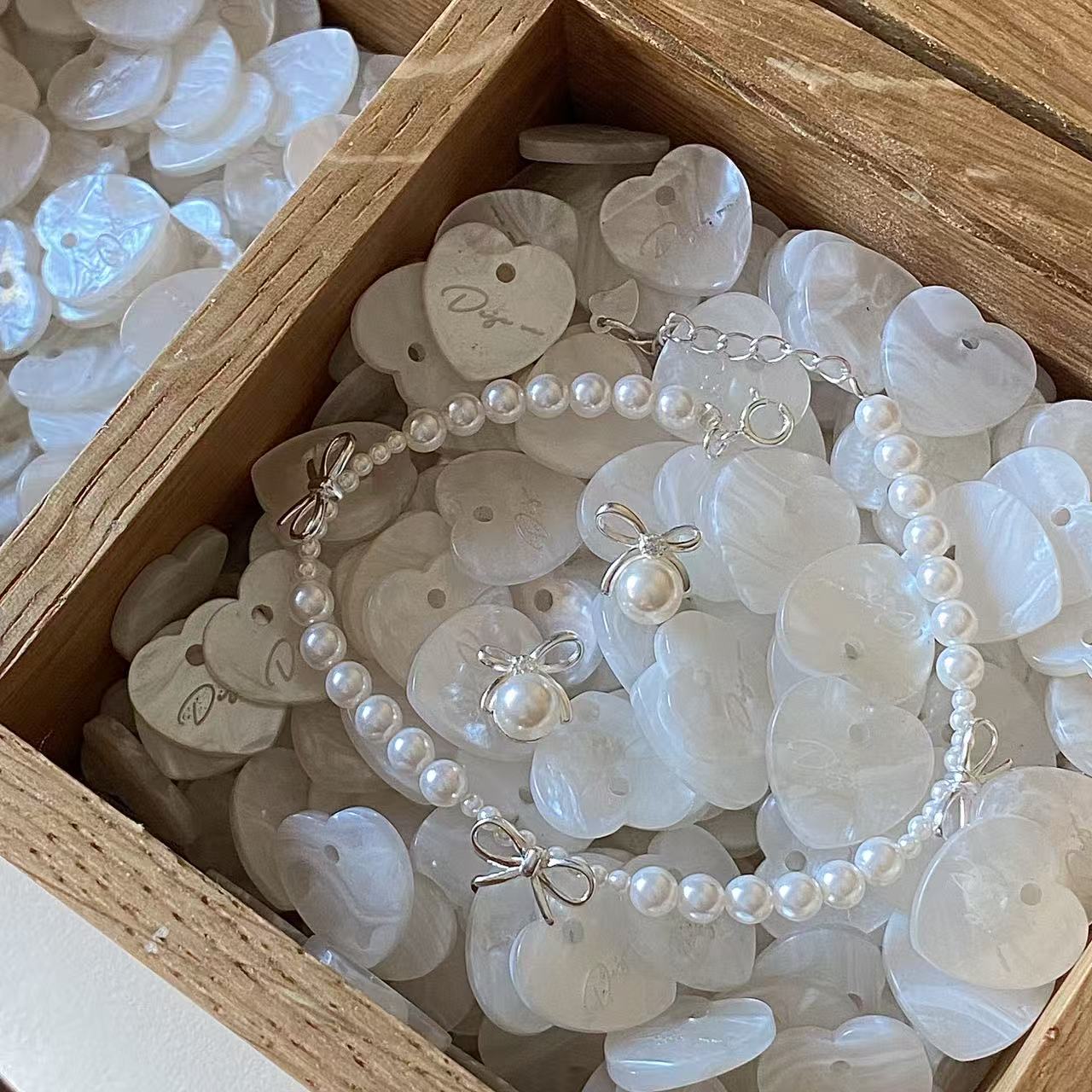 Dainty bow pearl bracelet close-up for bridesmaid gift