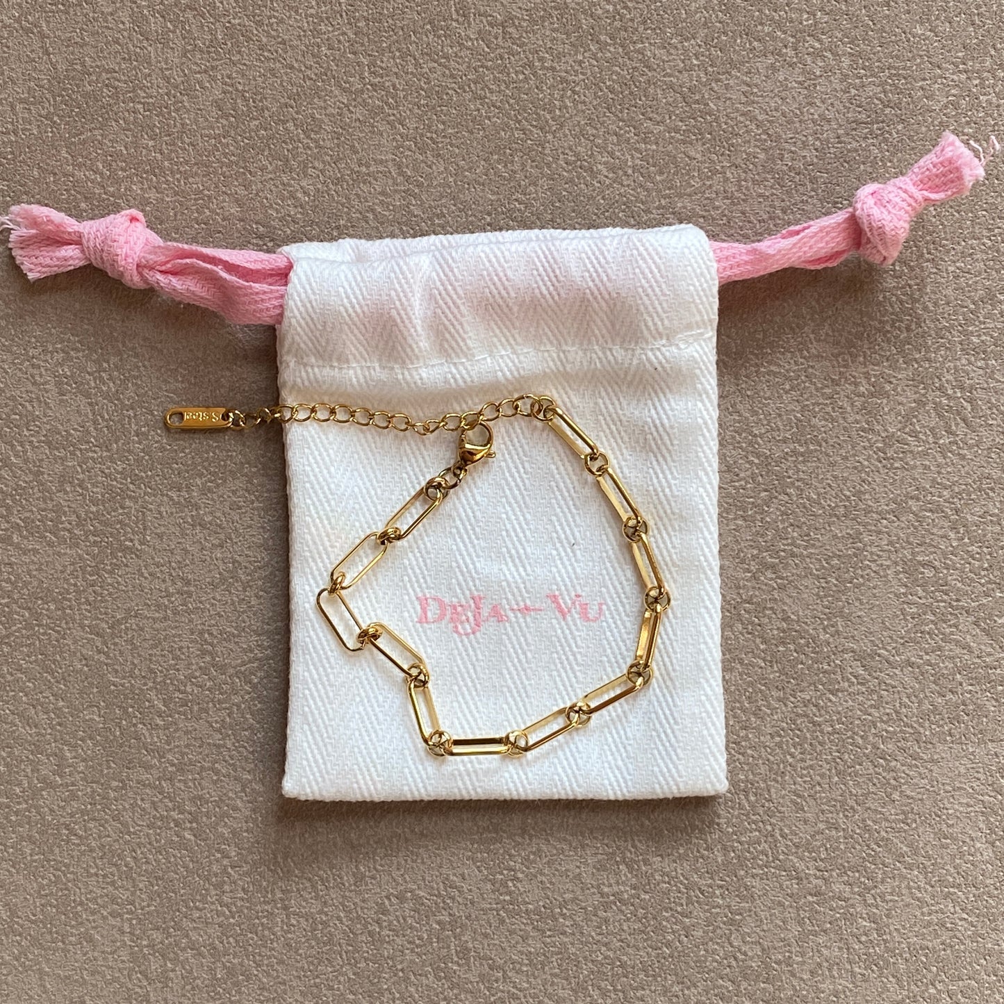 Gold paperclip chain bracelet on Deja vu Jewellery pouch, 16.5 cm plus 5 cm extender, lobster clasp
