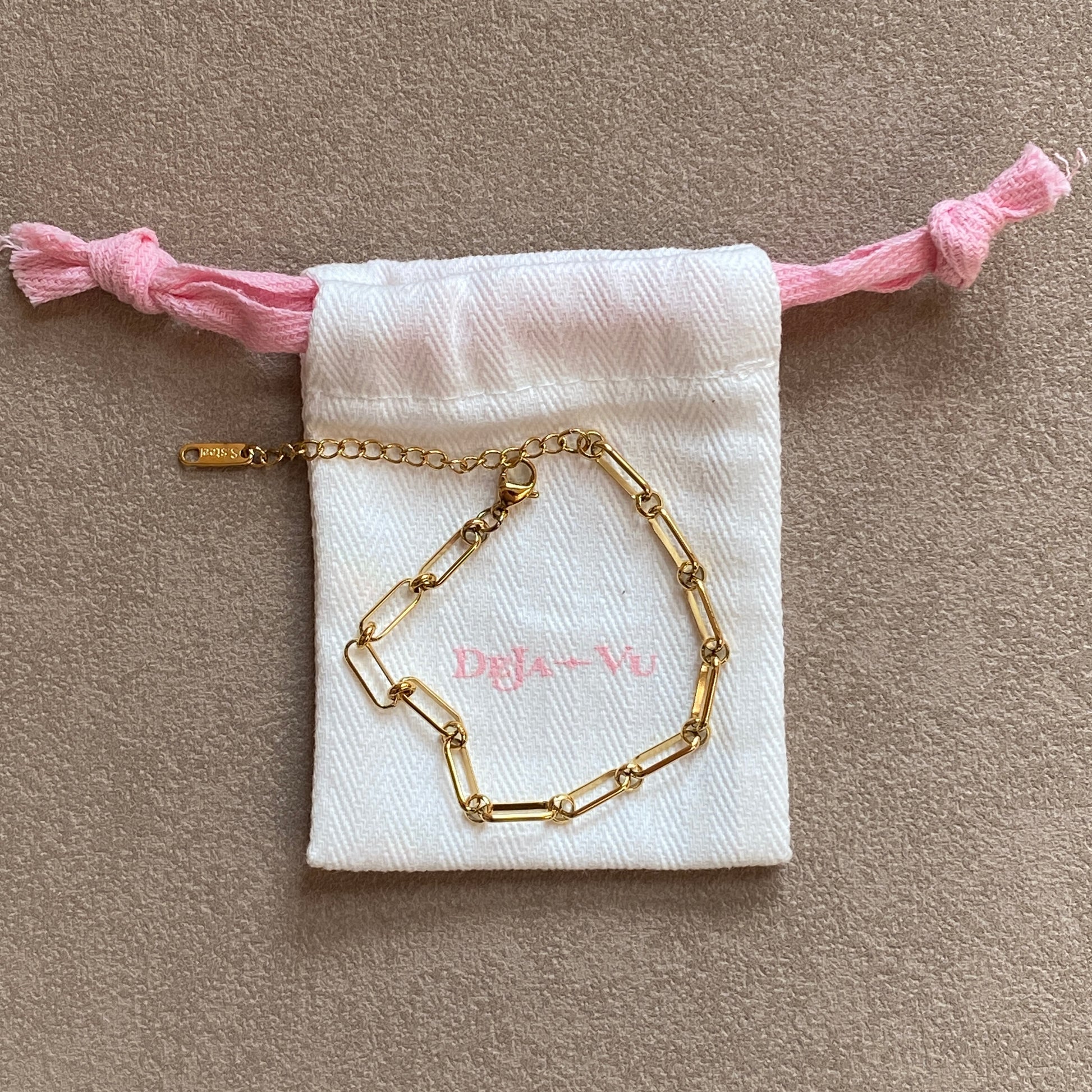 Gold paperclip chain bracelet on Deja vu Jewellery pouch, 16.5 cm plus 5 cm extender, lobster clasp