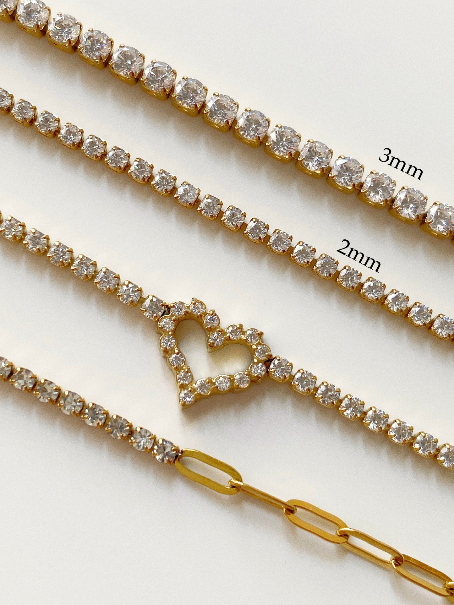 Classic 3mm tennis bracelet width comparison against dainty 2.0mm tennis bracelet styles in waterproof gold