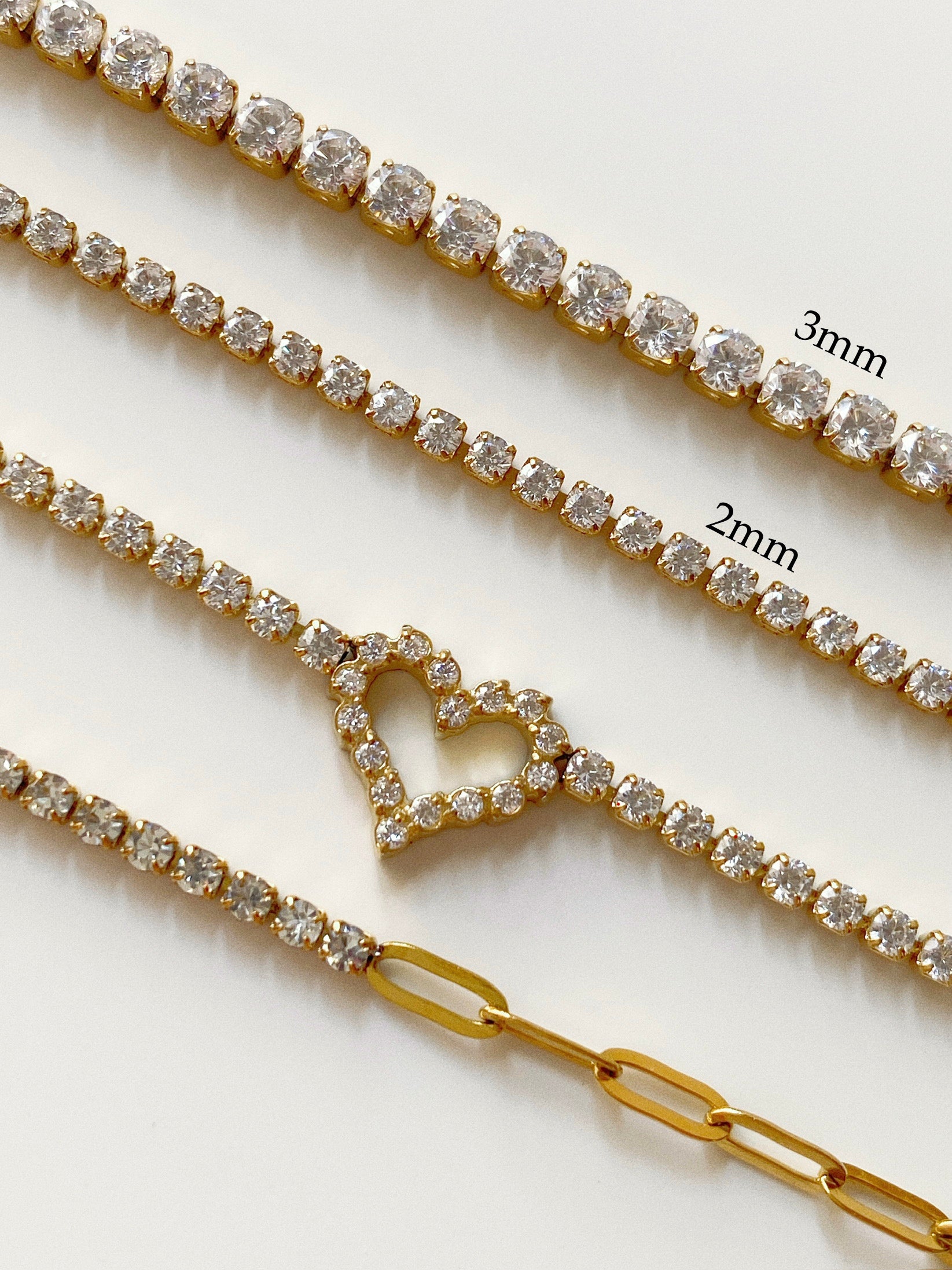 Classic 3mm tennis bracelet width comparison against dainty 2.0mm tennis bracelet styles in waterproof gold