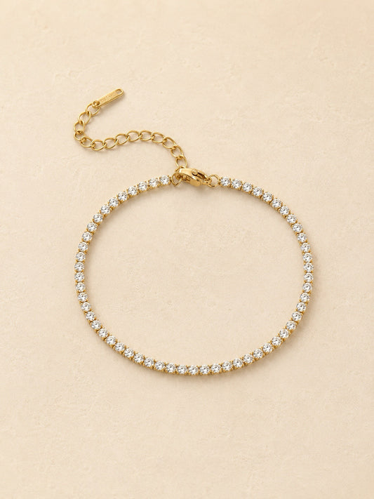 Gold tennis bracelet set with round cubic zirconia stones, adjustable extender and Deja Vu tag, waterproof stainless steel