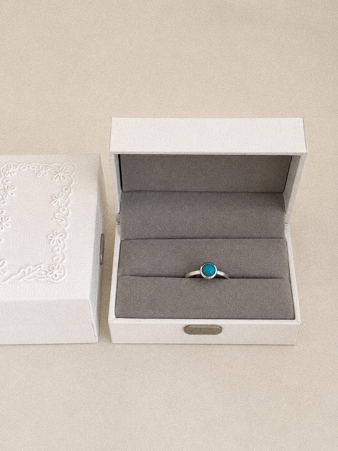 Cove Sleeping Beauty turquoise ring presented in a Deja vu Jewellery gift box with the blue stone facing forward.