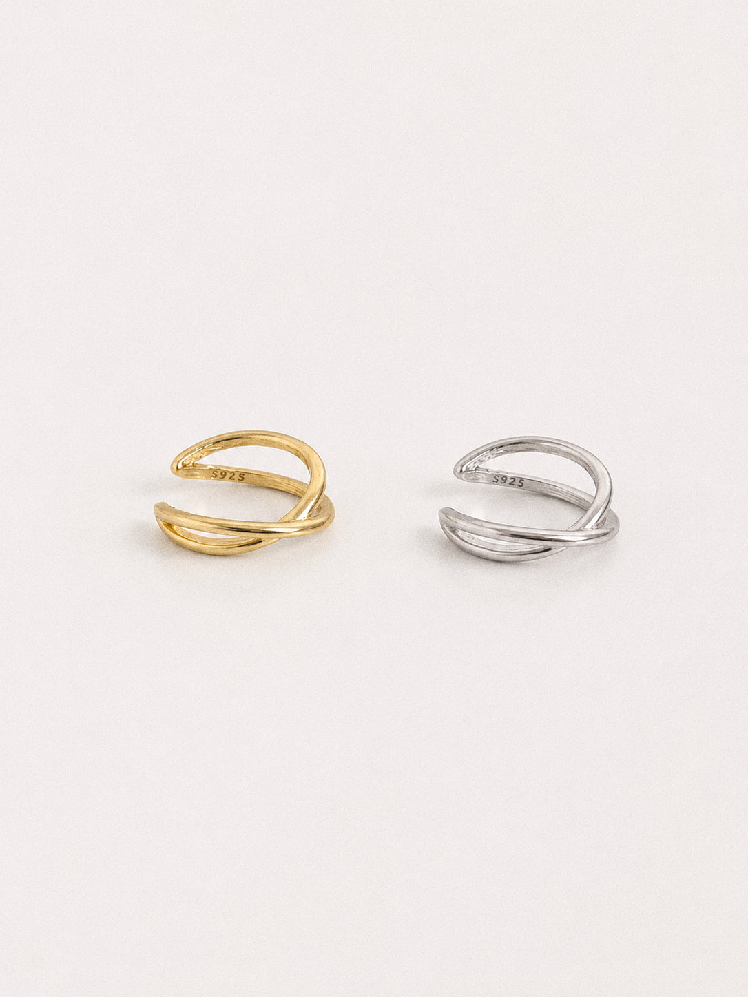 Gold and silver criss cross ear cuffs in 925 sterling silver shown side by side with S925 hallmark, no piercing needed