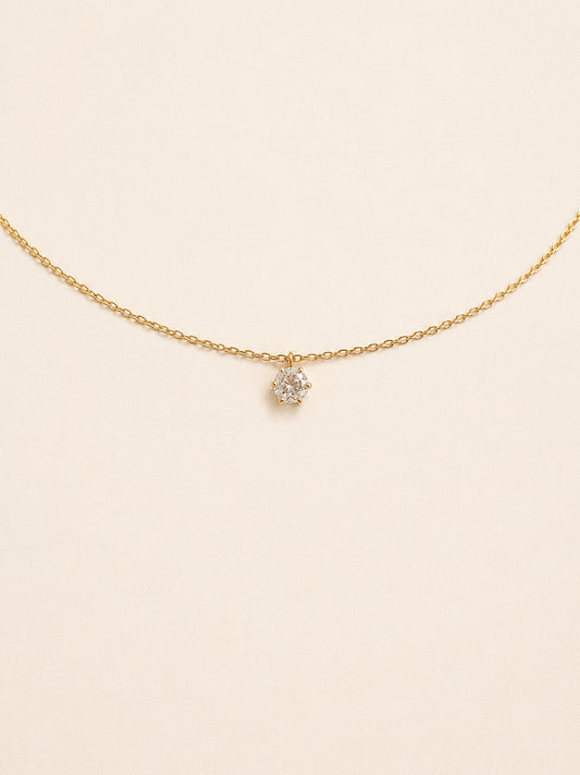 Icon cz solitaire necklace with a six claw round stone floating on a fine gold chain