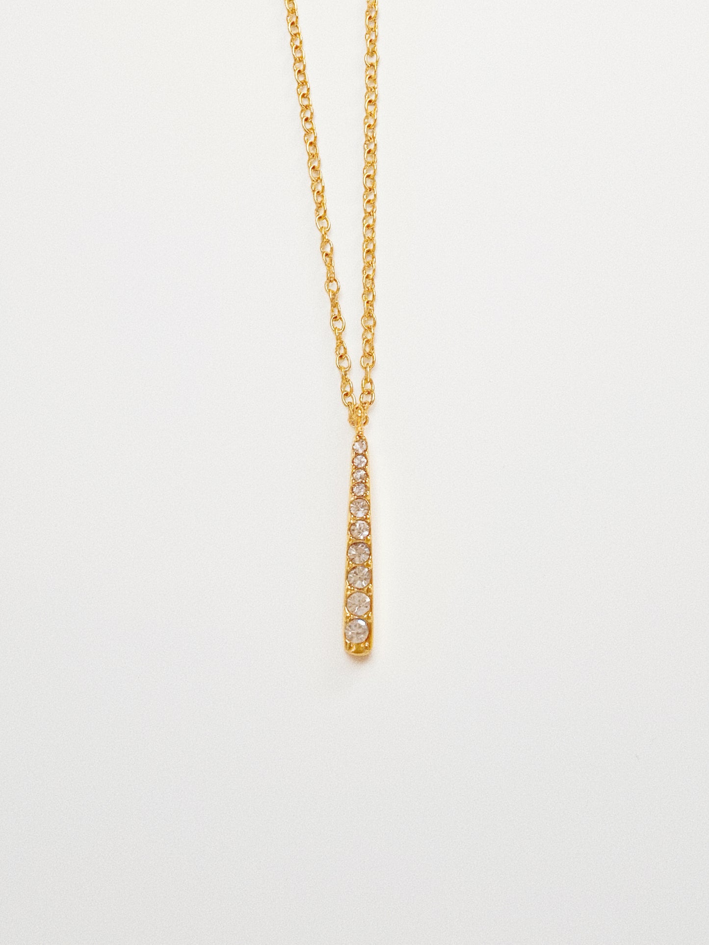 Minimalist gold stick necklace on a dainty cable chain, 18k gold plated stainless steel.
