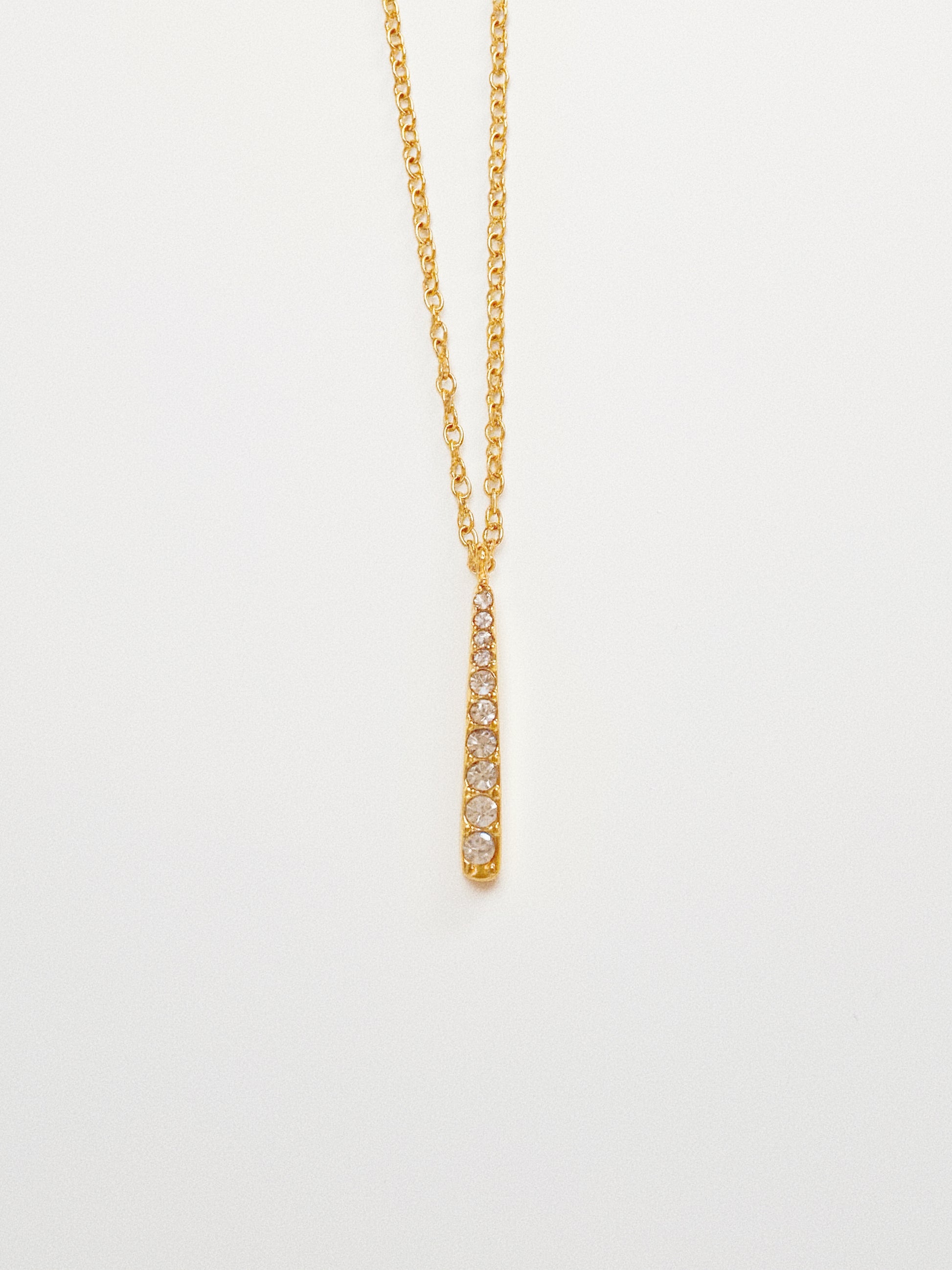 Minimalist gold stick necklace on a dainty cable chain, 18k gold plated stainless steel.