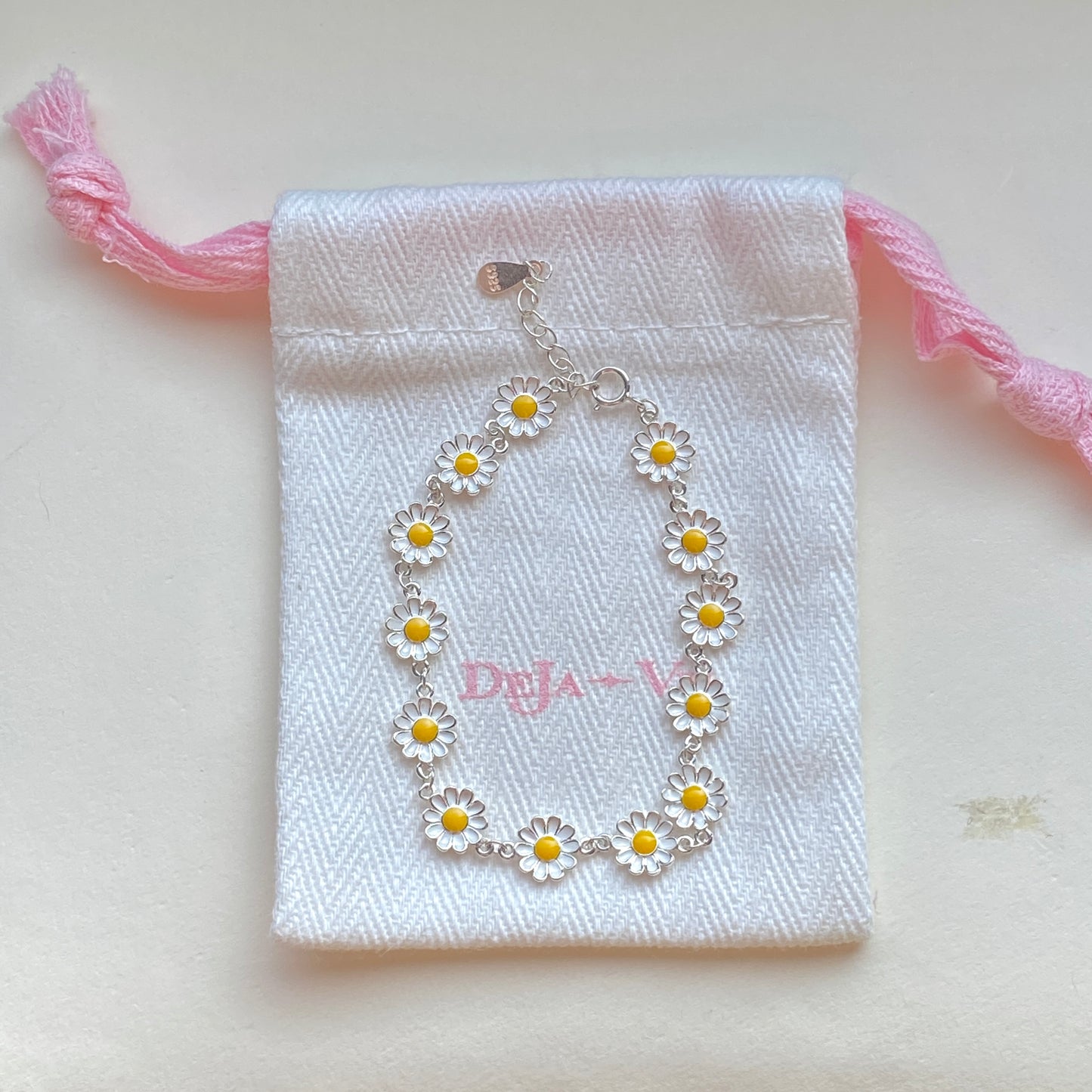 Gift pouch with sterling silver daisy bracelet ready for gifting