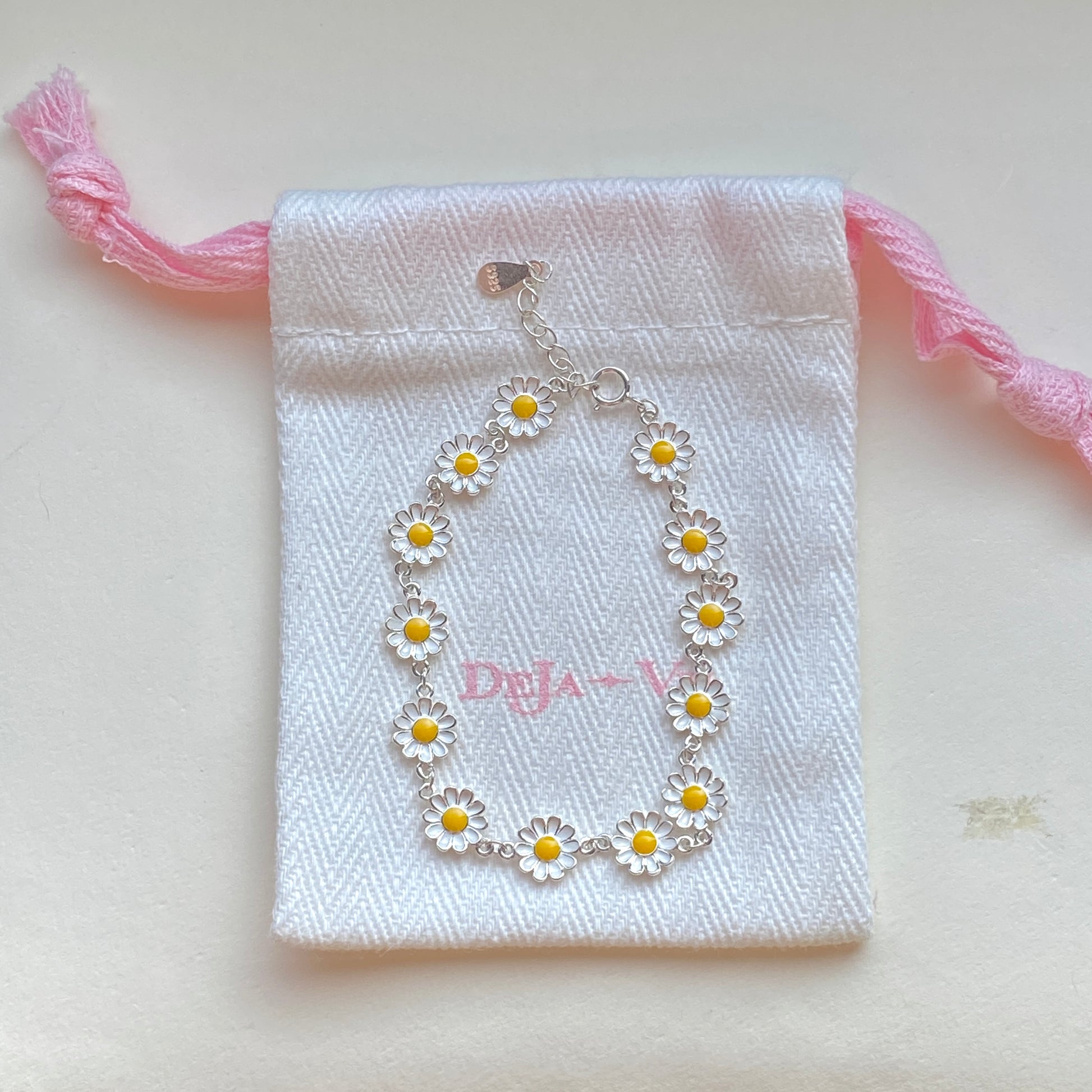 Gift pouch with sterling silver daisy bracelet ready for gifting