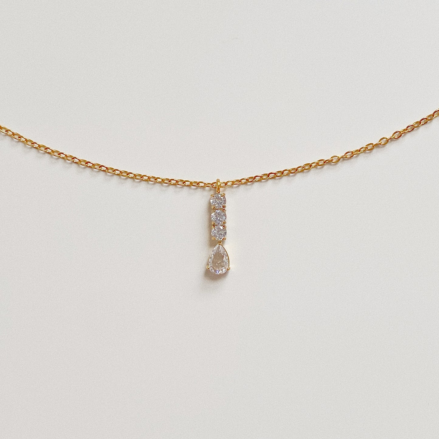 Dainty gold chain necklace with a sparkling crystal drop pendant, 18k gold plated stainless steel.