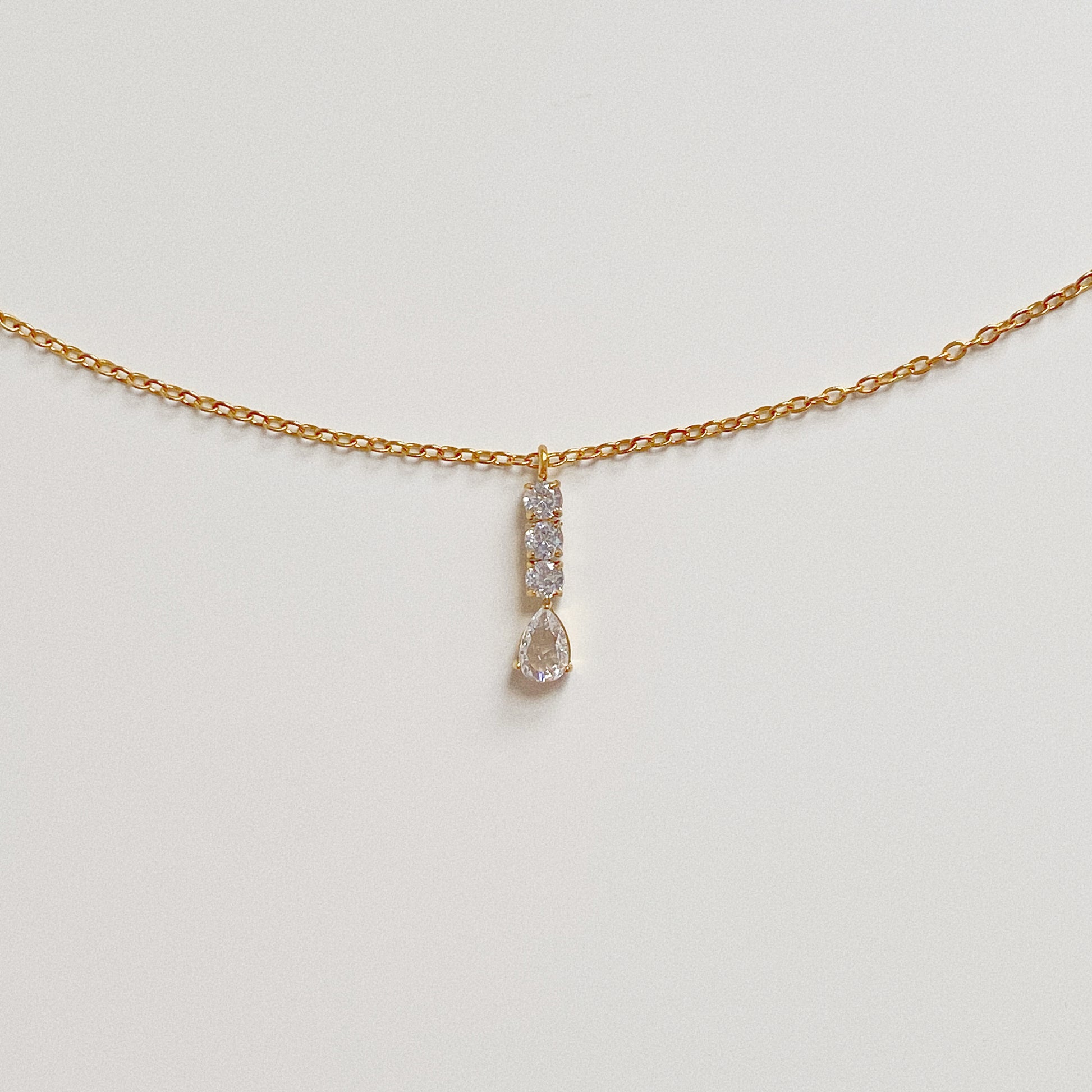 Dainty gold chain necklace with a sparkling crystal drop pendant, 18k gold plated stainless steel.