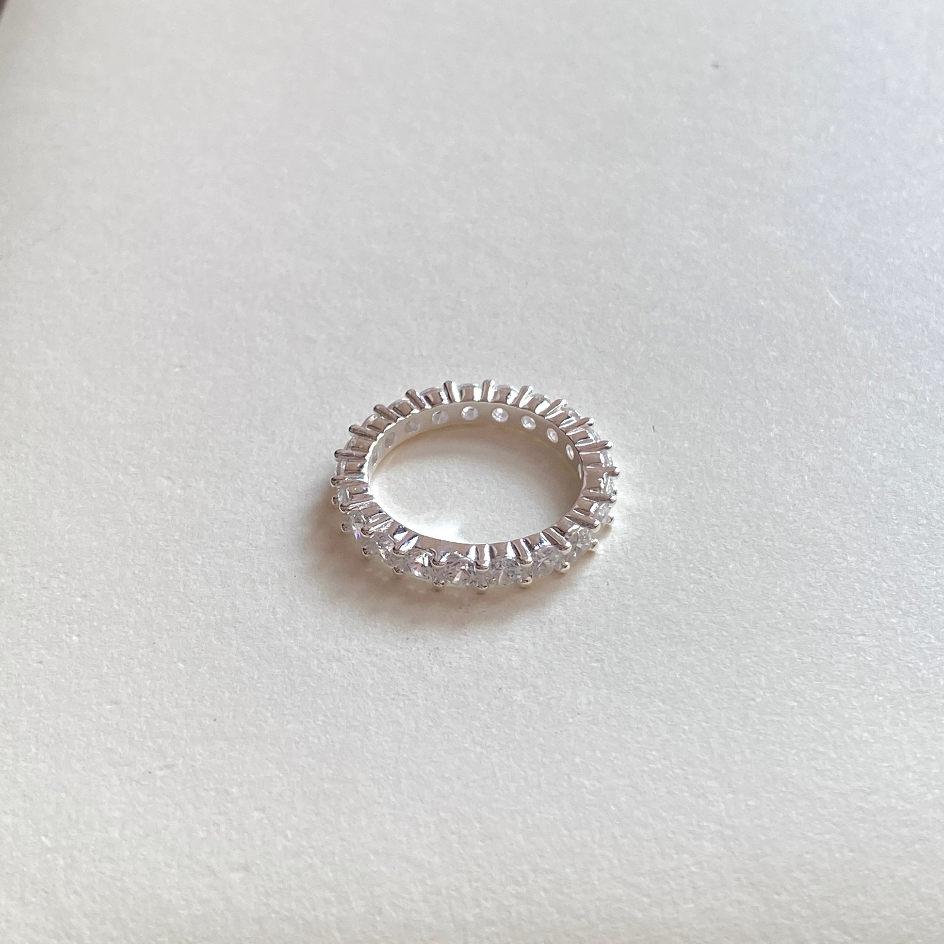 
Top-down view showing full circle of sterling silver promise ring.