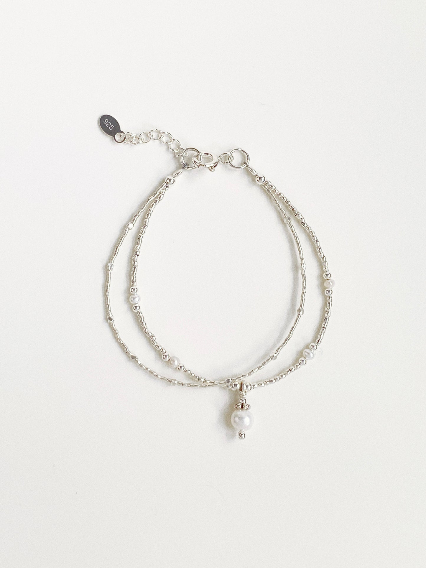 A 925 sterling silver double-layer fashion bracelet featuring natural freshwater pearls and Thai silver beads from Deja vu Jewellery.