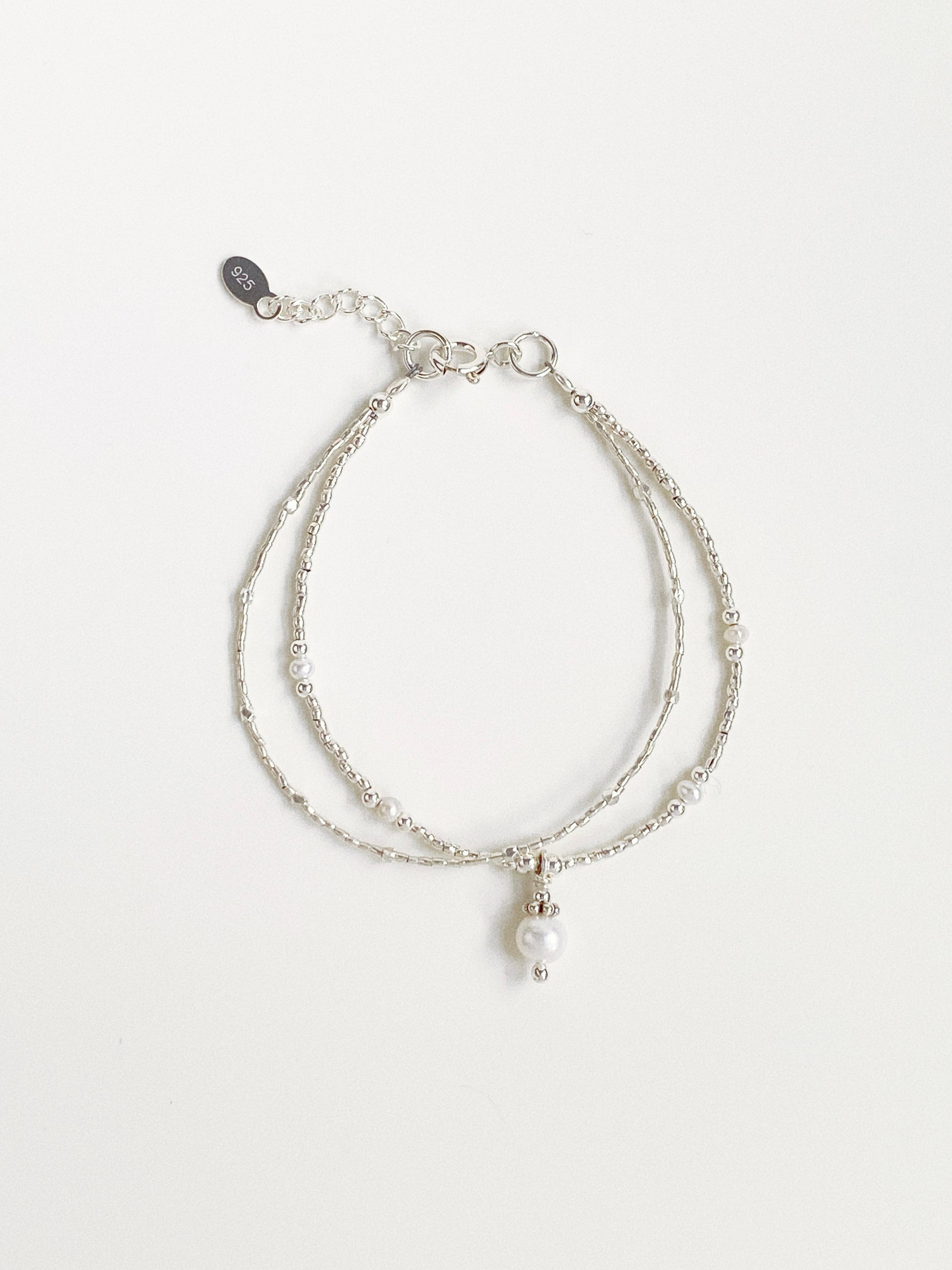 A 925 sterling silver double-layer fashion bracelet featuring natural freshwater pearls and Thai silver beads from Deja vu Jewellery.