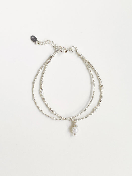 A 925 sterling silver double-layer fashion bracelet featuring natural freshwater pearls and Thai silver beads from Deja vu Jewellery.