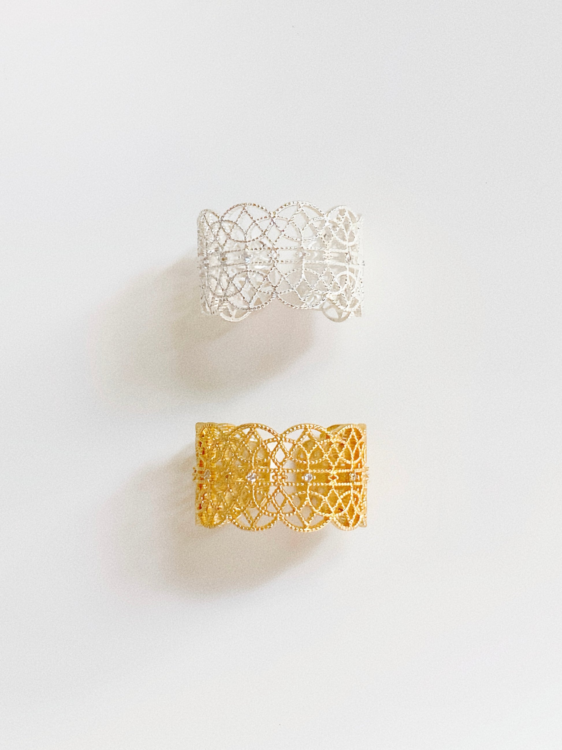 A comparison of the Gossamer Bloom lace ring in both 18k gold and sterling silver plating.