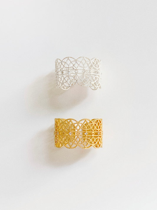 A comparison of the Gossamer Bloom lace ring in both 18k gold and sterling silver plating.