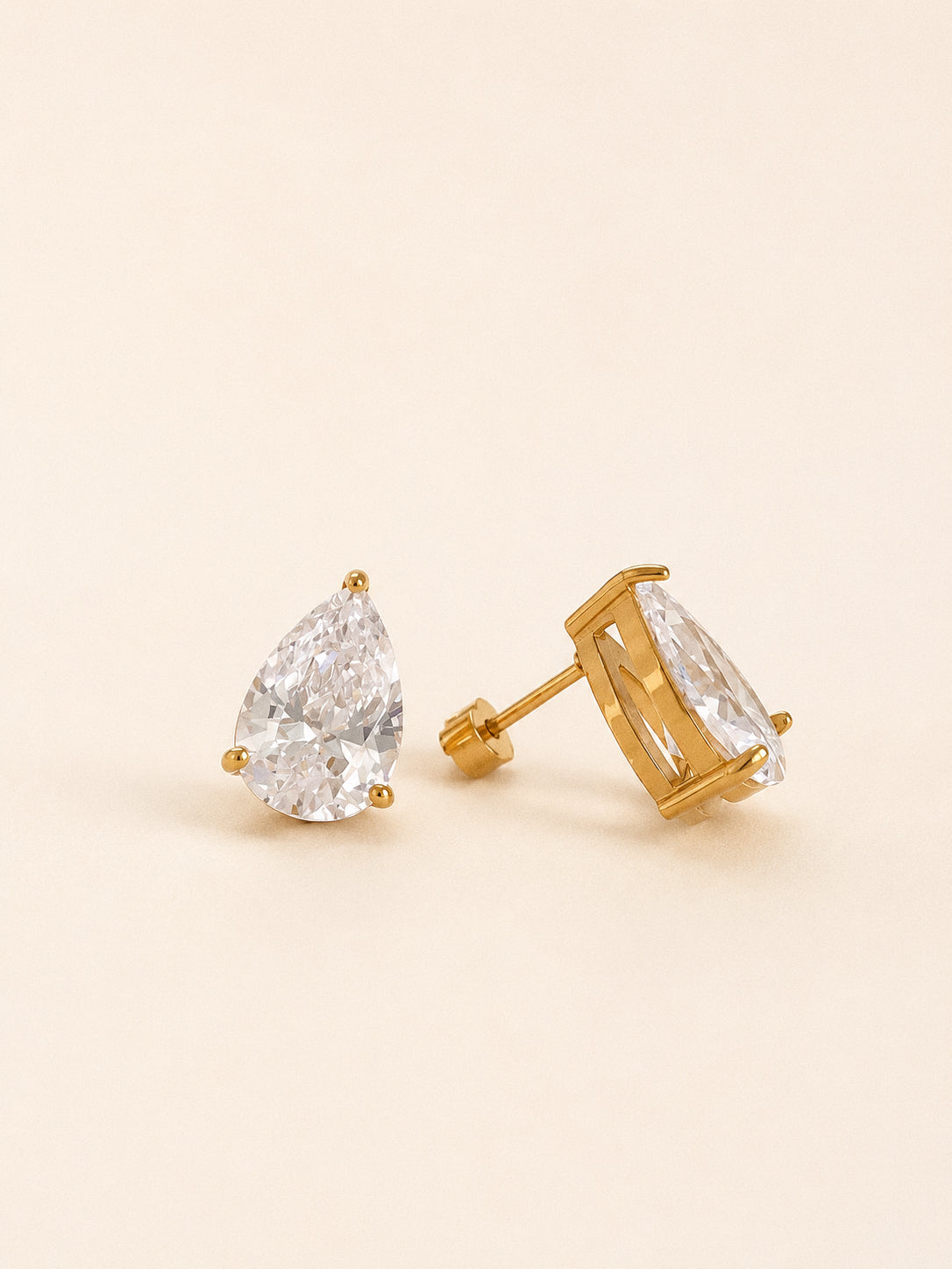 The pear stud earrings from the Dew set showing the claw setting and screw back posts