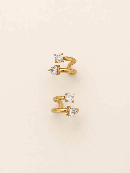 Duet double ear cuff with a round cz on the upper coil and a heart cut stone below in 18k gold