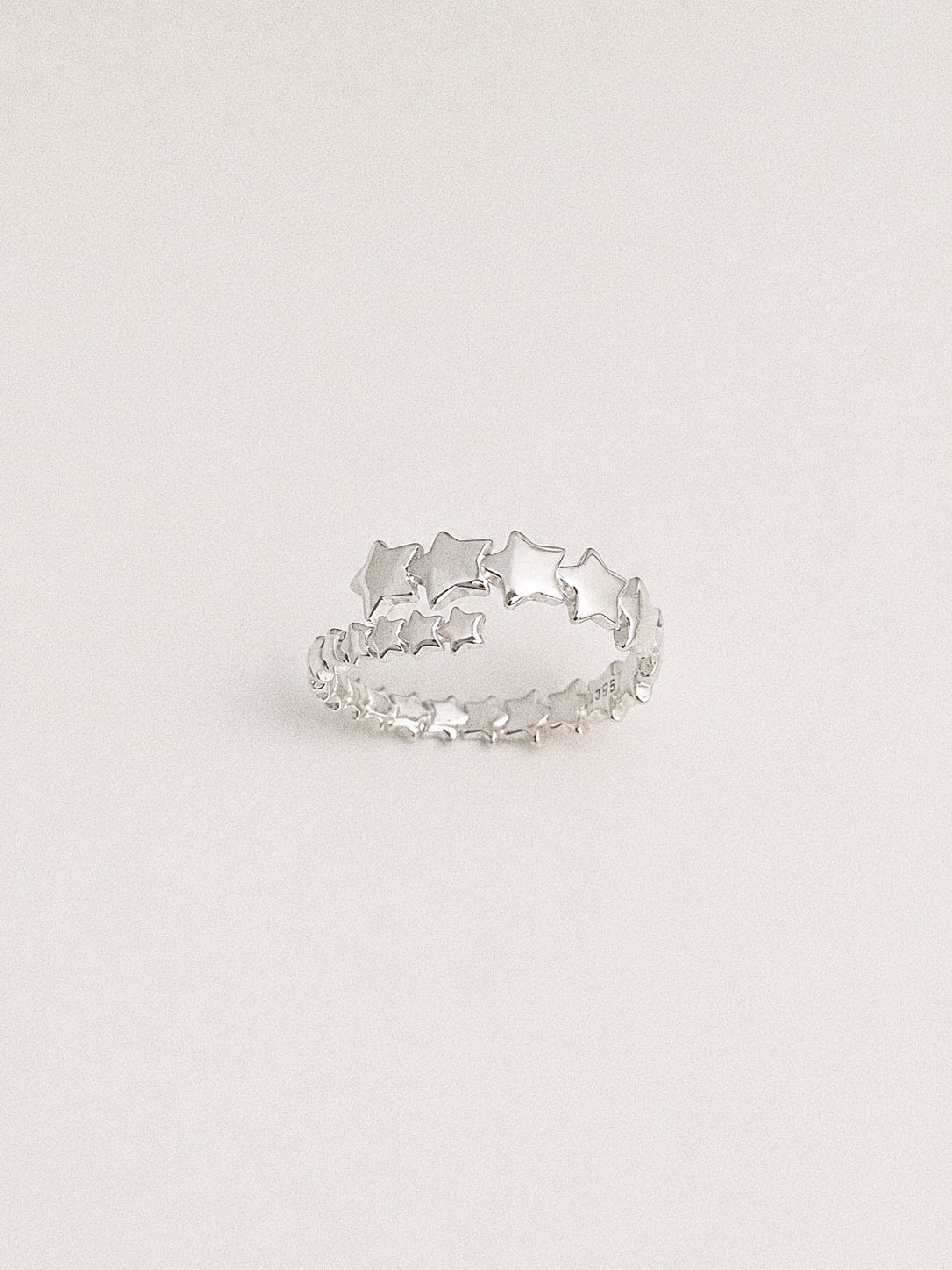 Drift dainty multi star ring in 925 sterling silver, with two rows of polished stars growing towards the centre.