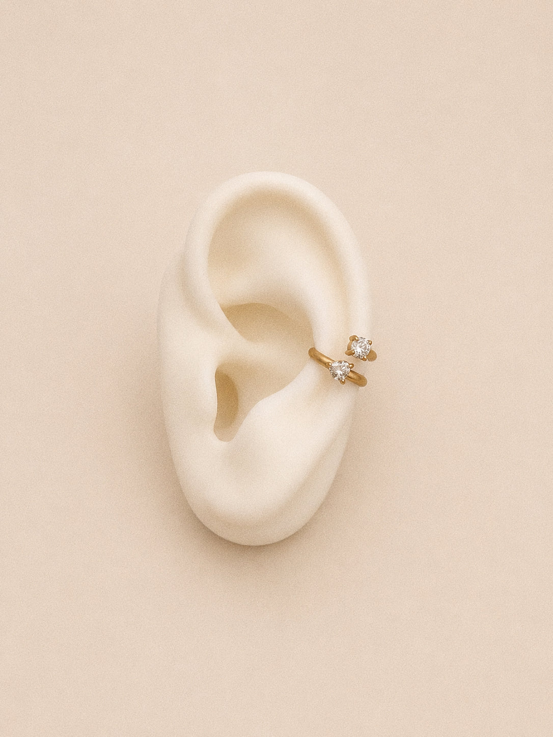 Duet double ear cuff shown on an ear display sitting mid ear where the spiral slides on with no piercing