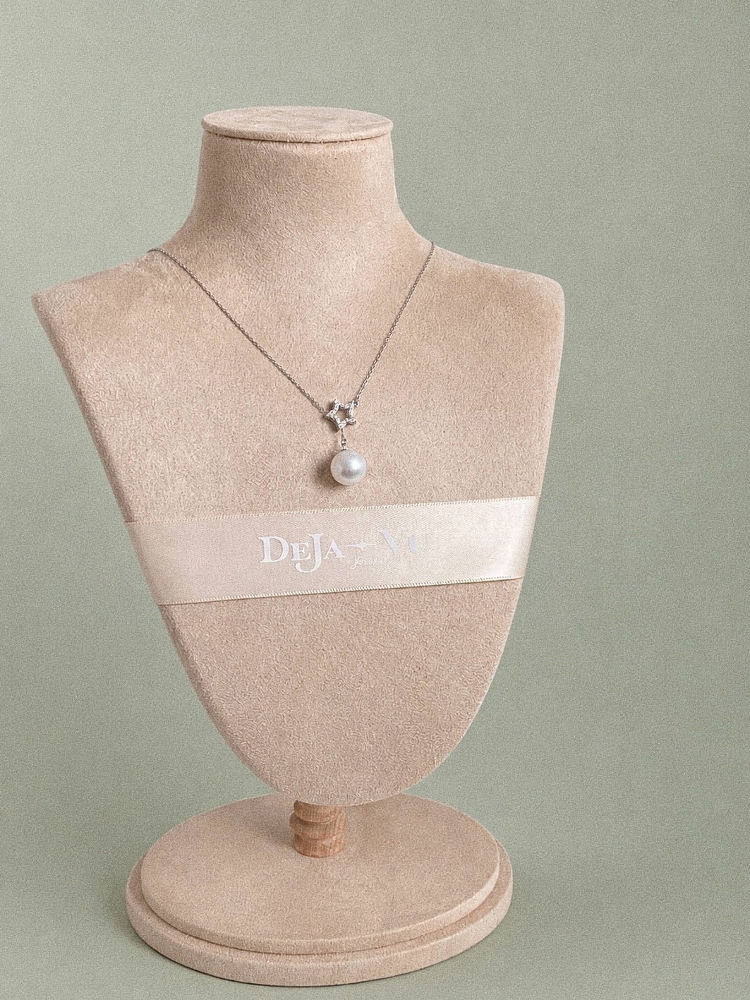 Full view of the Astra Edison pearl Y necklace displayed on a jewellery bust, showing its fine sterling silver chain.