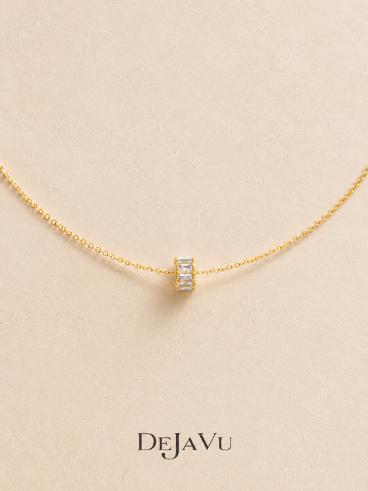 Dainty gold necklace with a tiny baguette zircon spinning wheel charm pendant, waterproof titanium steel by Deja Vu