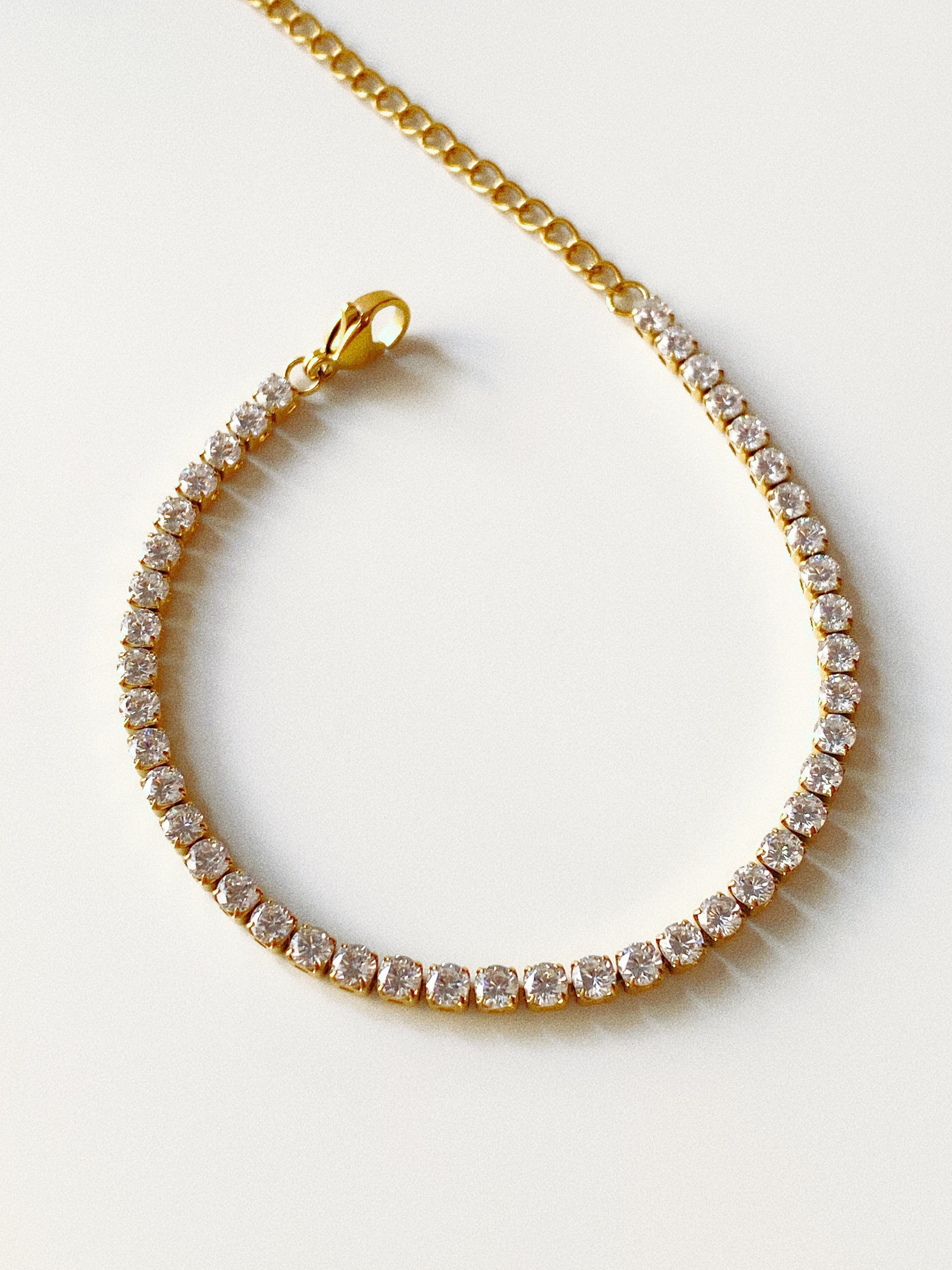2.9mm classic cz tennis bracelet in waterproof gold stainless steel with secure lobster clasp
