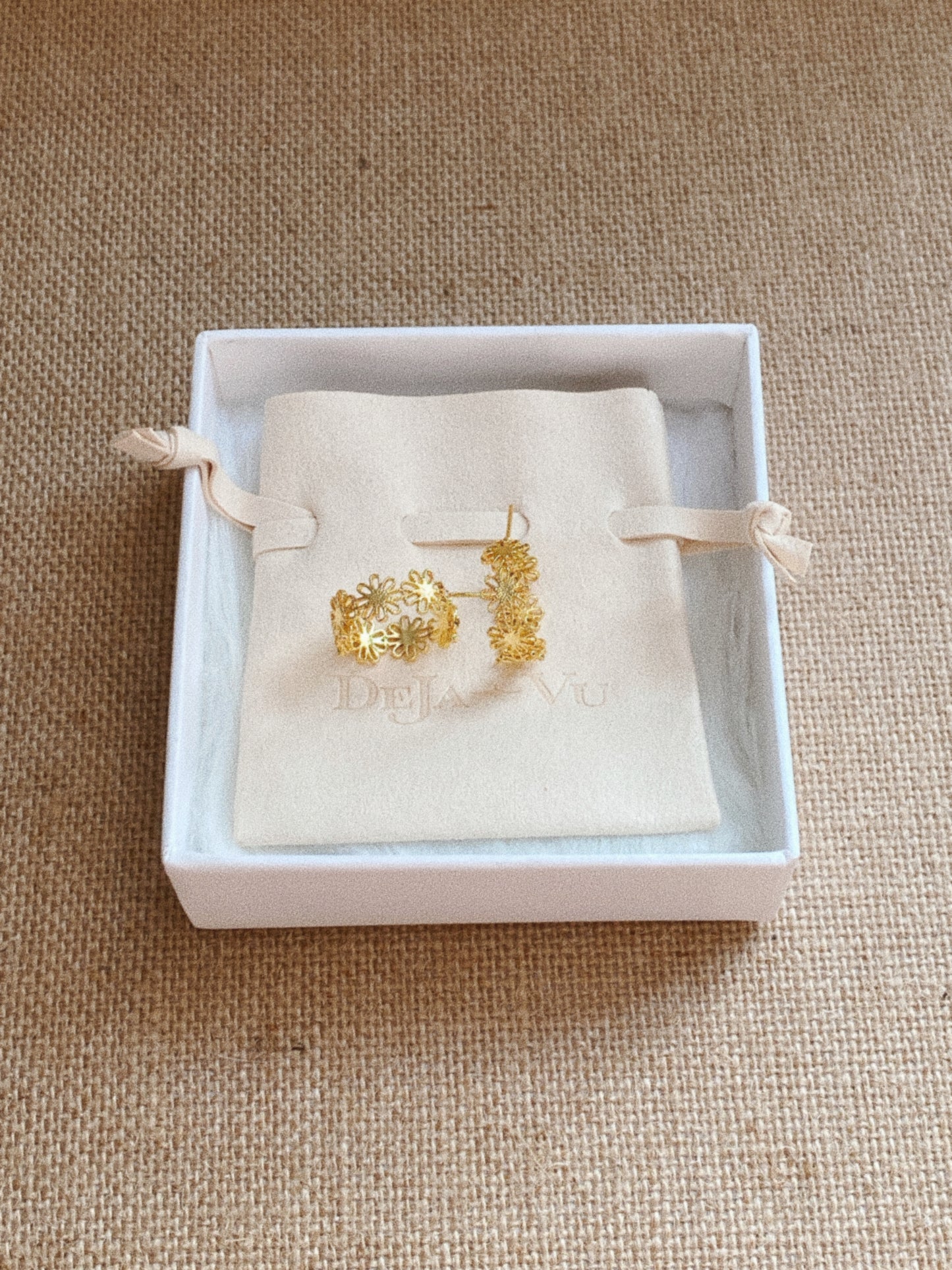 Gold daisy lace floral hoop earrings presented in Deja Vu Jewellery branded gift box and pouch