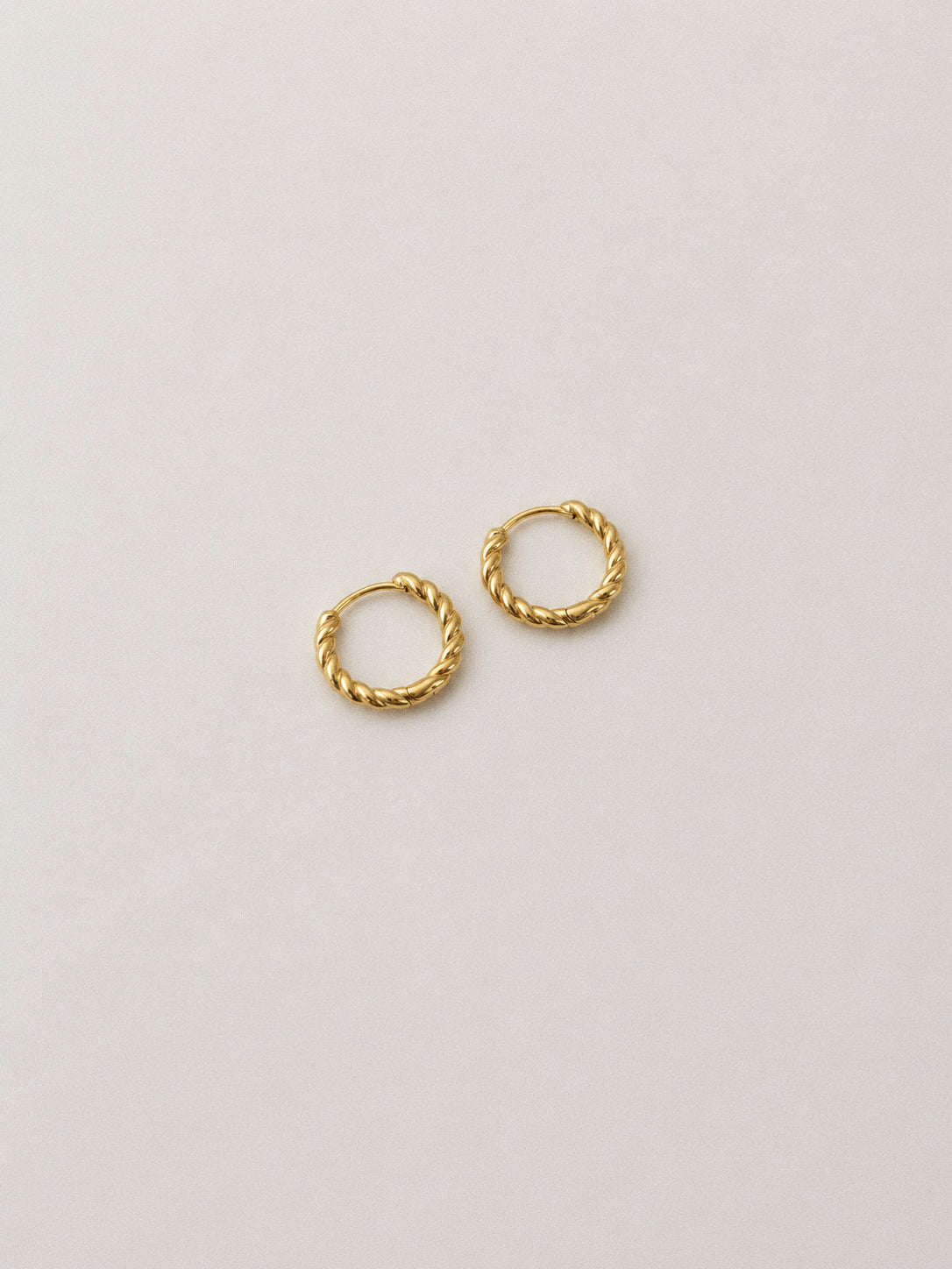Pair of gold twisted rope huggie hoop earrings in 18k gold plated sterling silver, small snug everyday hoops