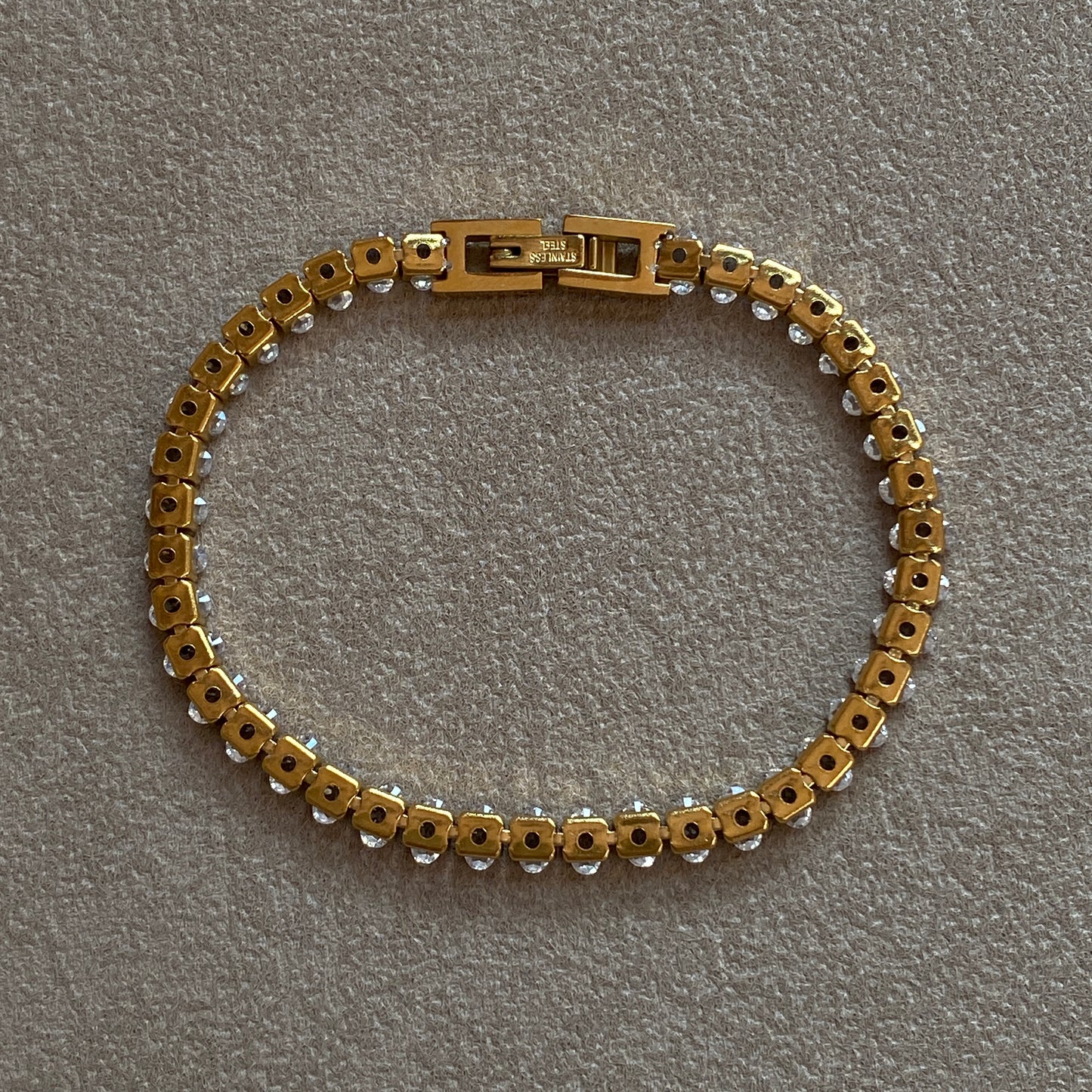 Back view of gold stainless steel Oval CZ Tennis Bracelet showing link construction and clasp—durable waterproof hypoallergenic design.