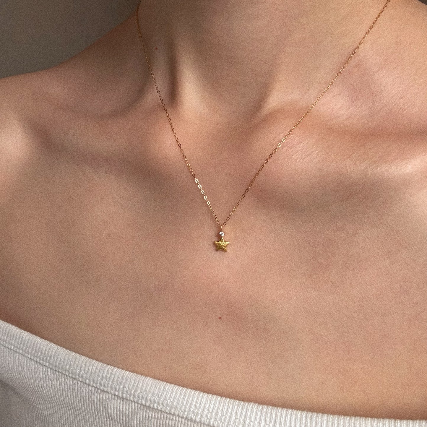 Dainty 18K gold plated Christmas star necklace on collarbone – Deja vu Jewellery